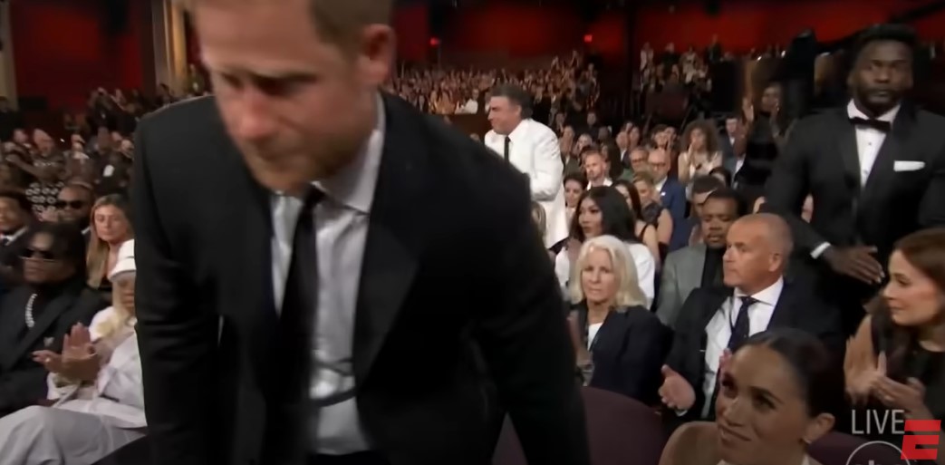 Prince Harry and Duchess Meghan touch hands before he walks to the ESPY Award stage to accept the Pat Tillman Award for Service on July 11, 2024, in Hollywood, California | Source: YouTube/ESPN