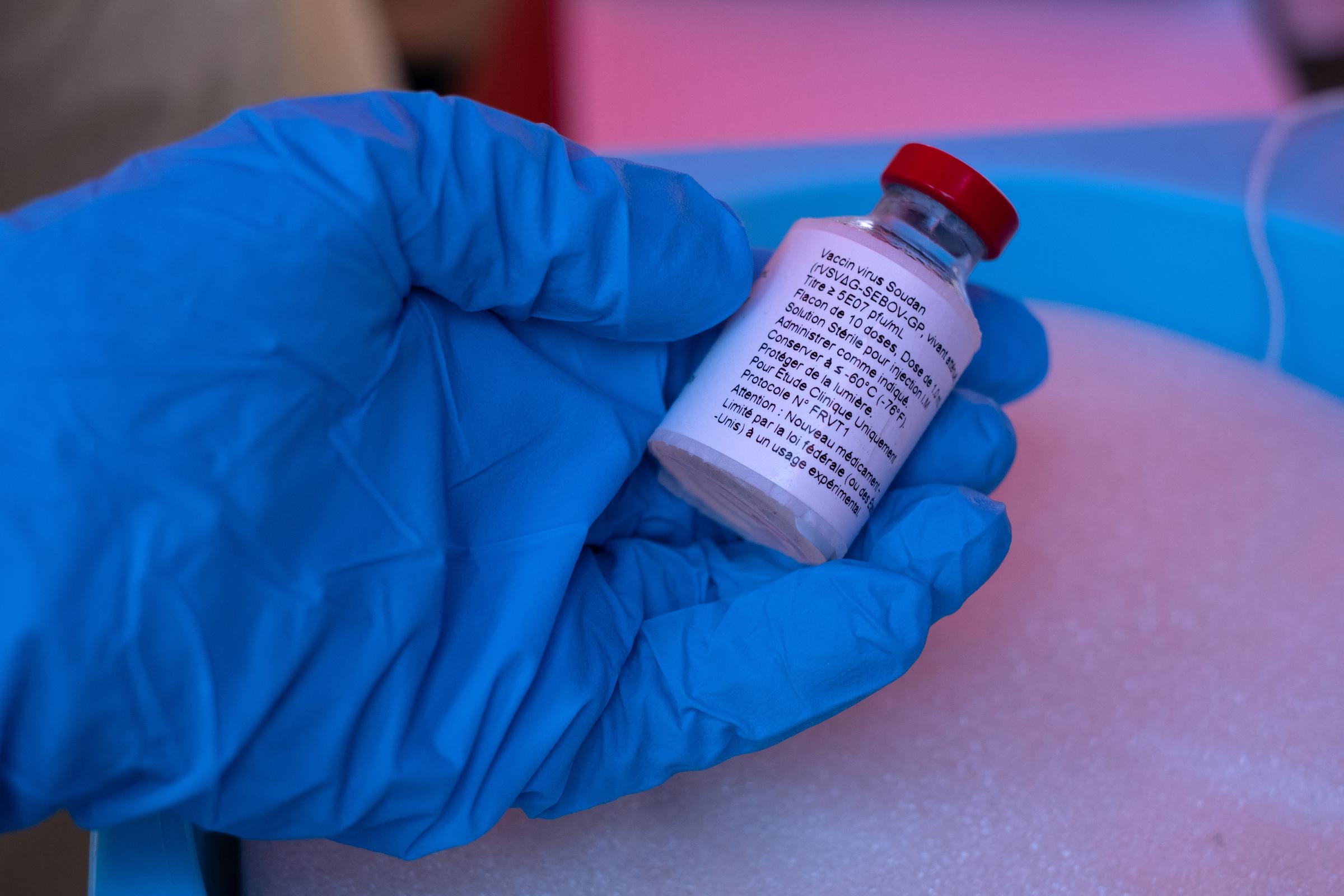 A nurse holds a vial of the Ebola Sudan vaccine during the launch of an Ebola trial vaccination campaign at Mulago Referral Hospital in Kampala, Uganda, on February 3, 2025. | Source: Getty Images