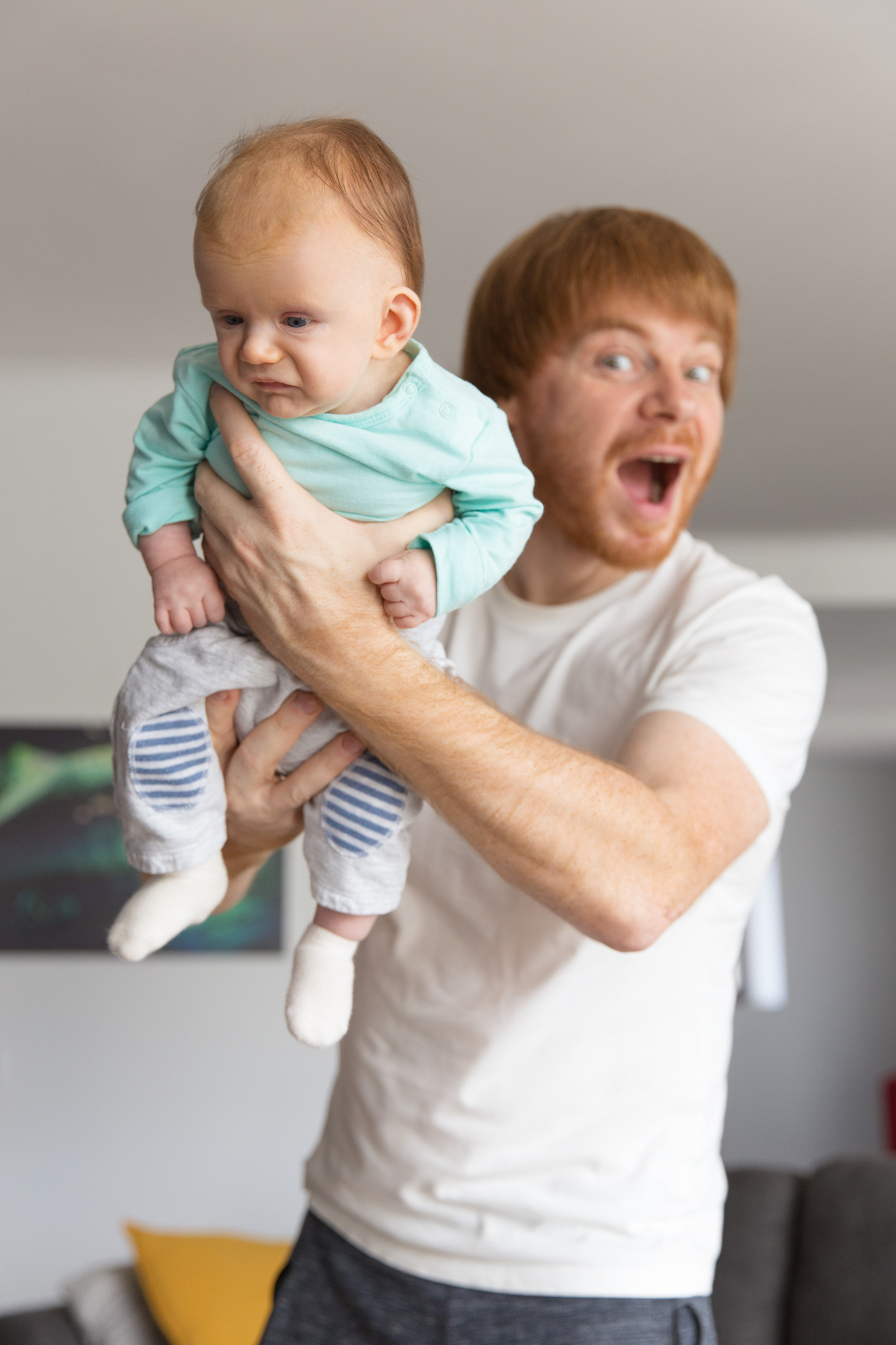 An upset man handing over a baby | Source: Freepik