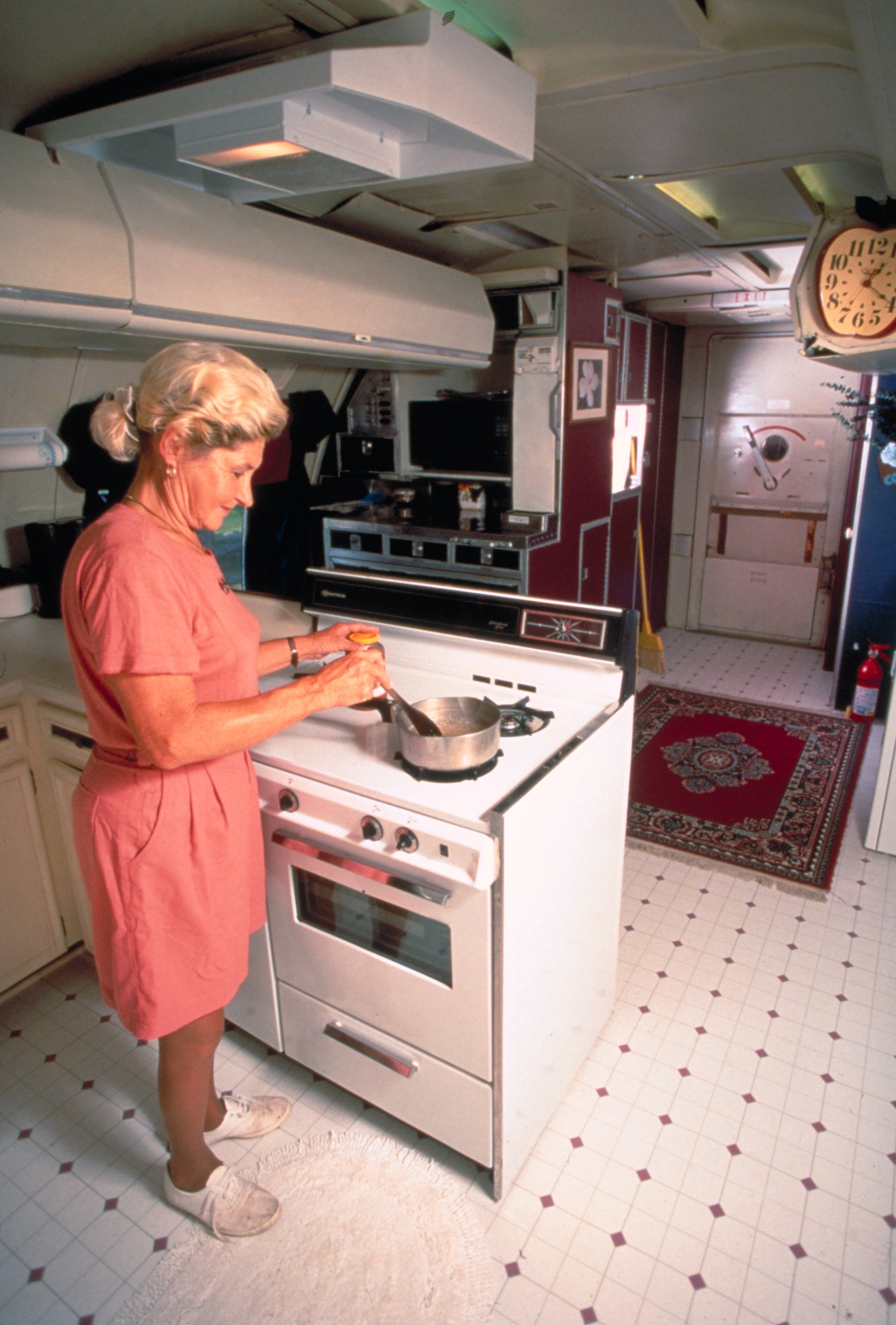 Beautician Jo Ann Ussery cooking at home, which is converted Boeing 727 fuselage. | Source: Getty Images