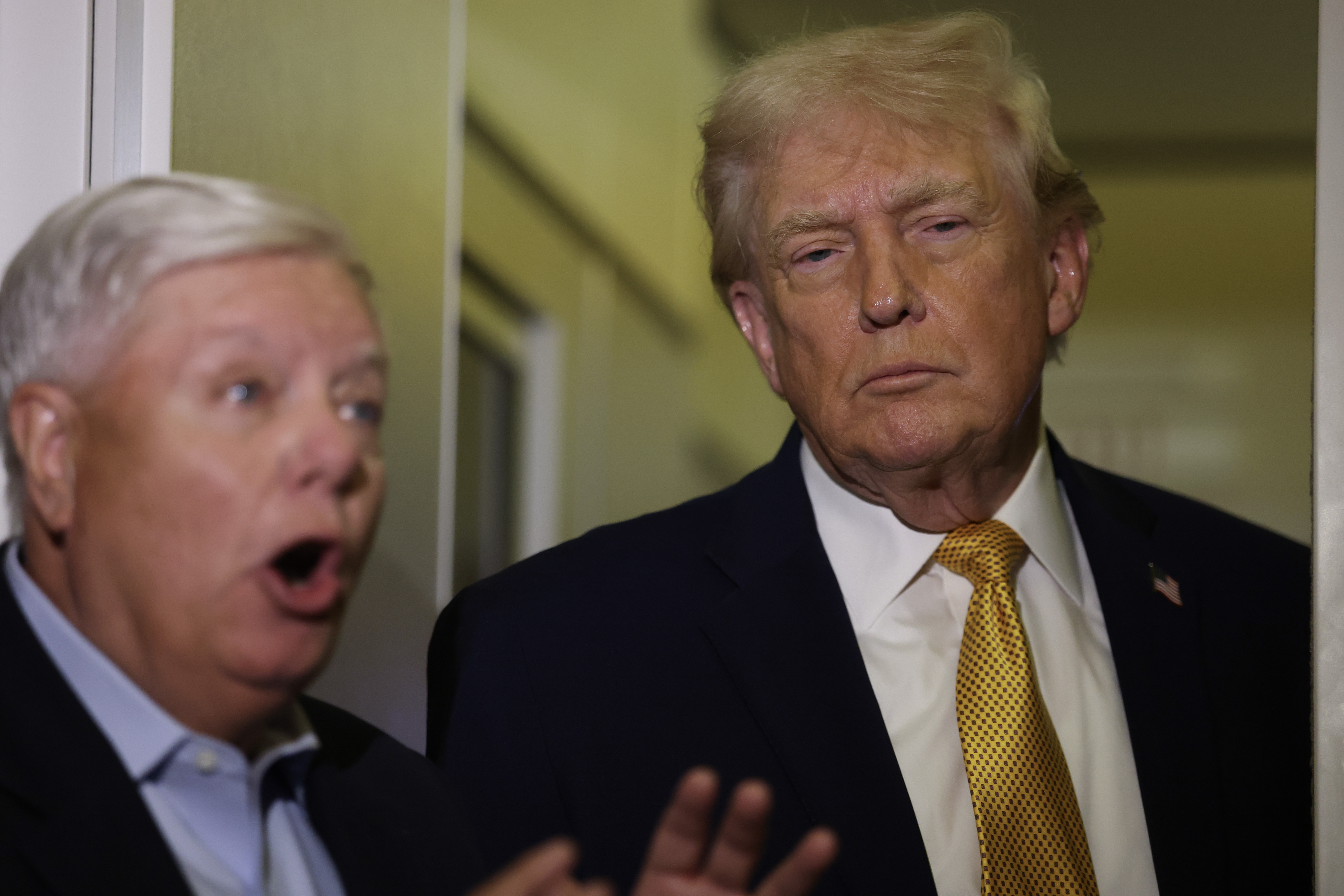 Trump and Graham speak to reporters aboard Air Force One in January 2026. During his funeral tribute, Trump shared a series of humorous stories that reflected the close friendship the two developed over the years. | Source: Getty Images