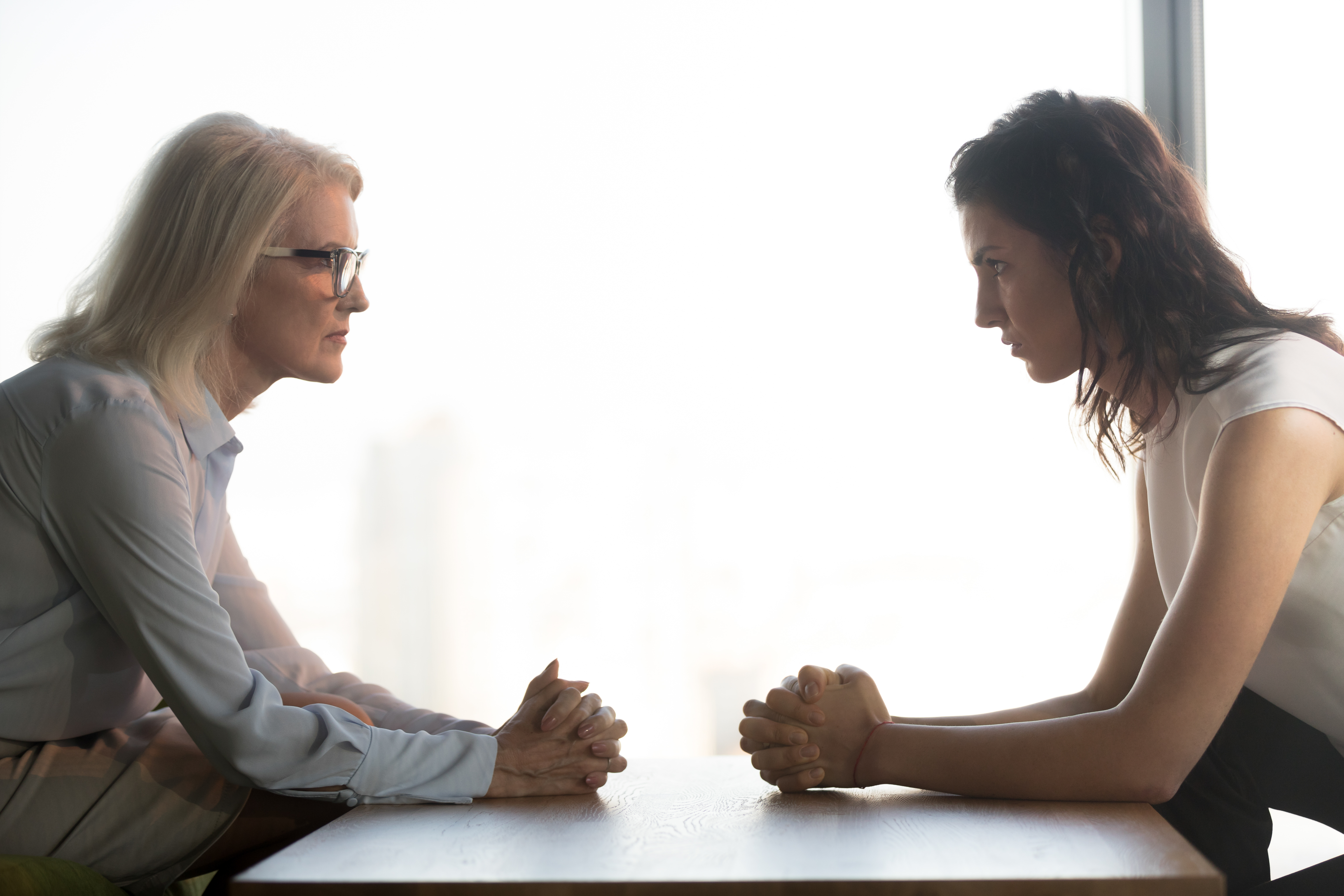 Angry women looking at each other | Source: Shutterstock