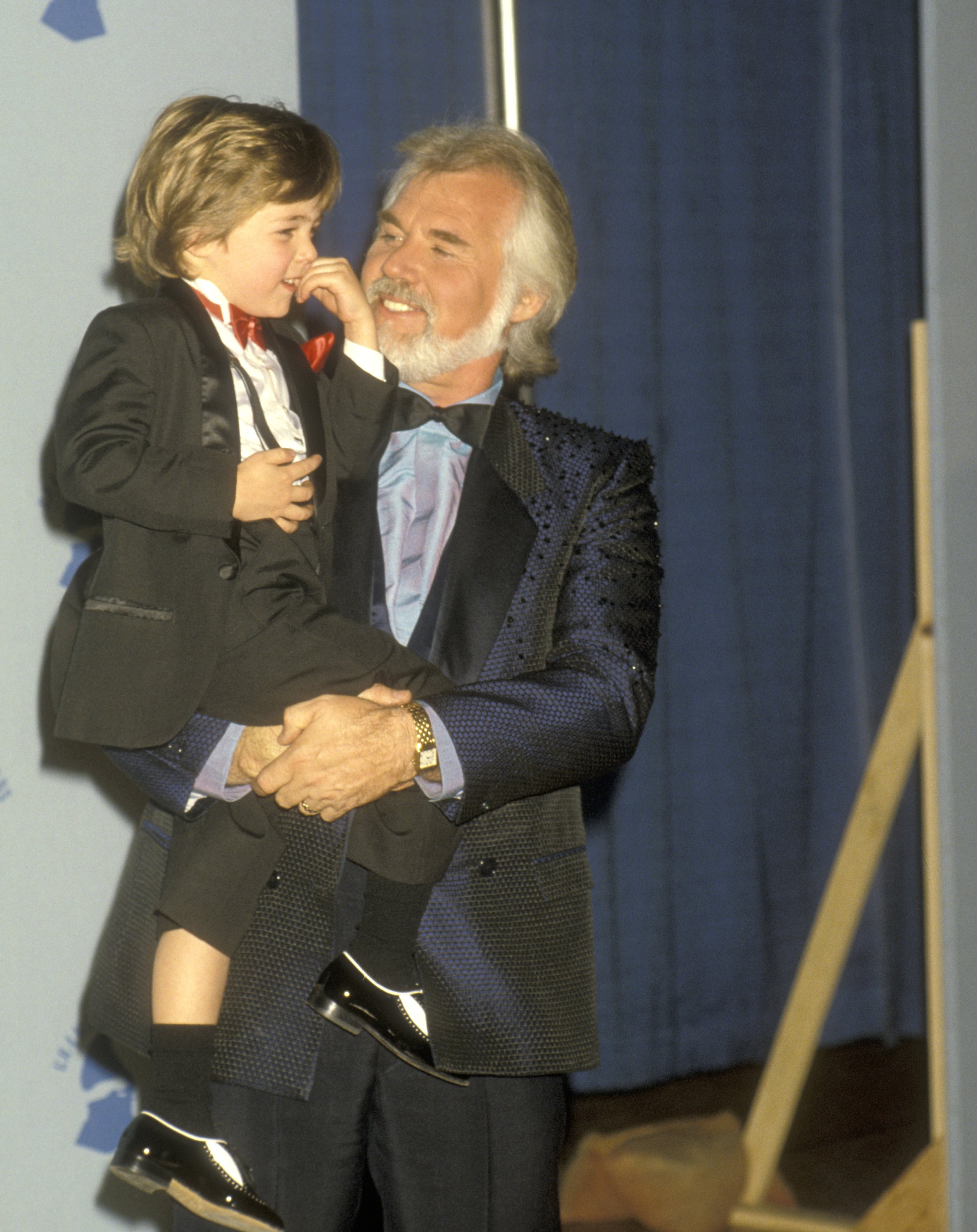 Kenny Rogers and son Christopher Gordon attend the 28th Annual Grammy Awards on February 25, 1986 at Shrine Auditorium in Los Angeles, California. | Photo: Getty Images