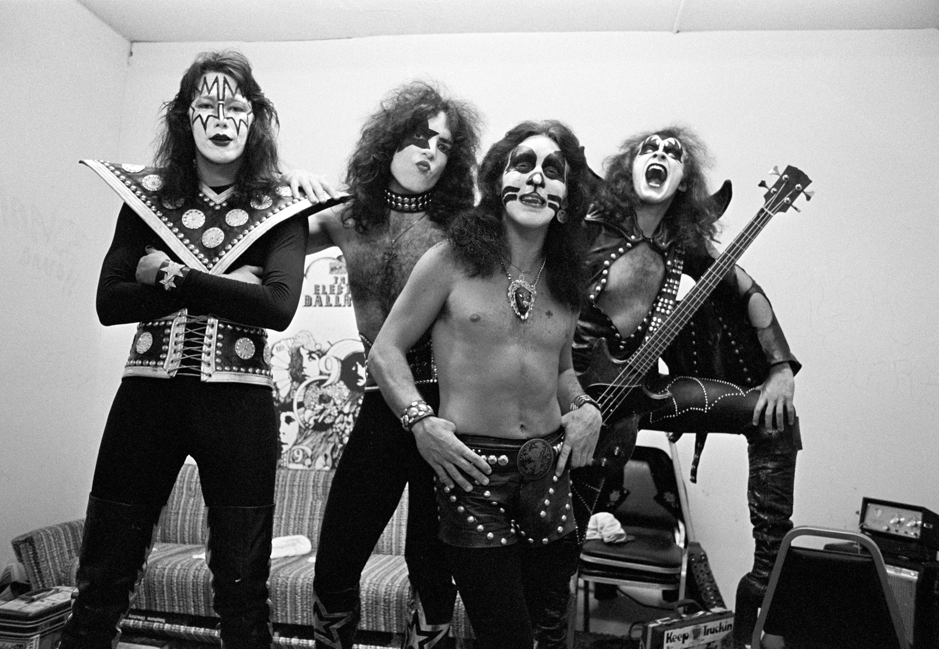 Guitarist Ace Frehley, singer-guitarist Paul Stanley, drummer Peter Criss, and bassist Gene Simmons of Kiss pose in the dressing room before performing on July 18, 1974 | Source: Getty Images
