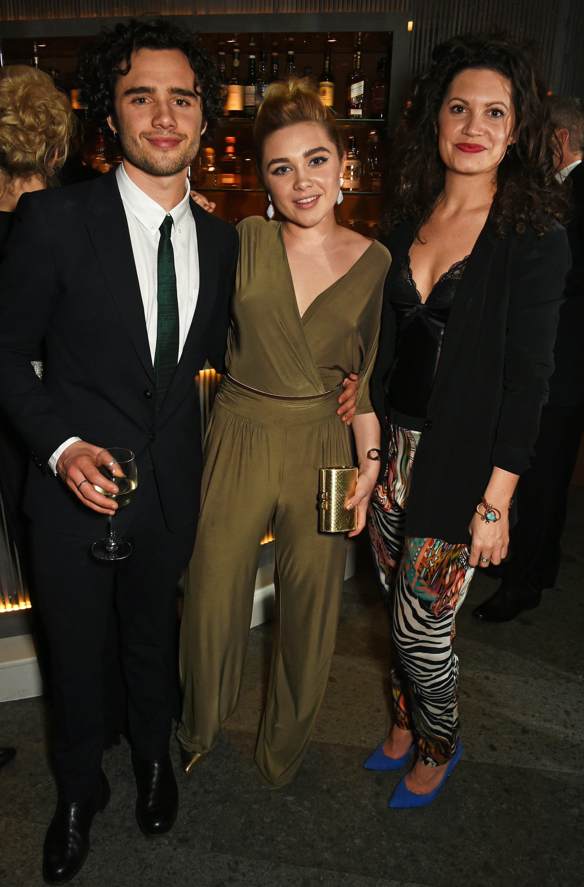 Toby Sebastian, Florence Pugh, and Arabella Gibbins attend the London Critics' Circle Film Awards after party on January 17, 2016, in London, England. | Source: Getty Images