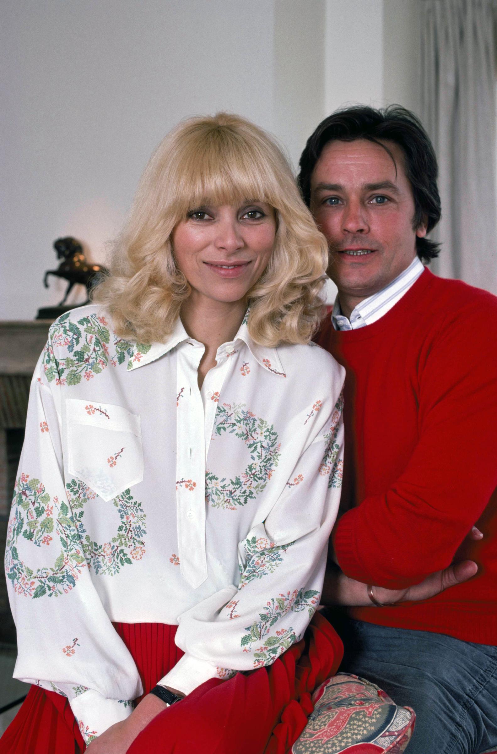 Mireille Darc and Alain Delon at home in Paris, France, March 22, 1978. | Source: Getty Images