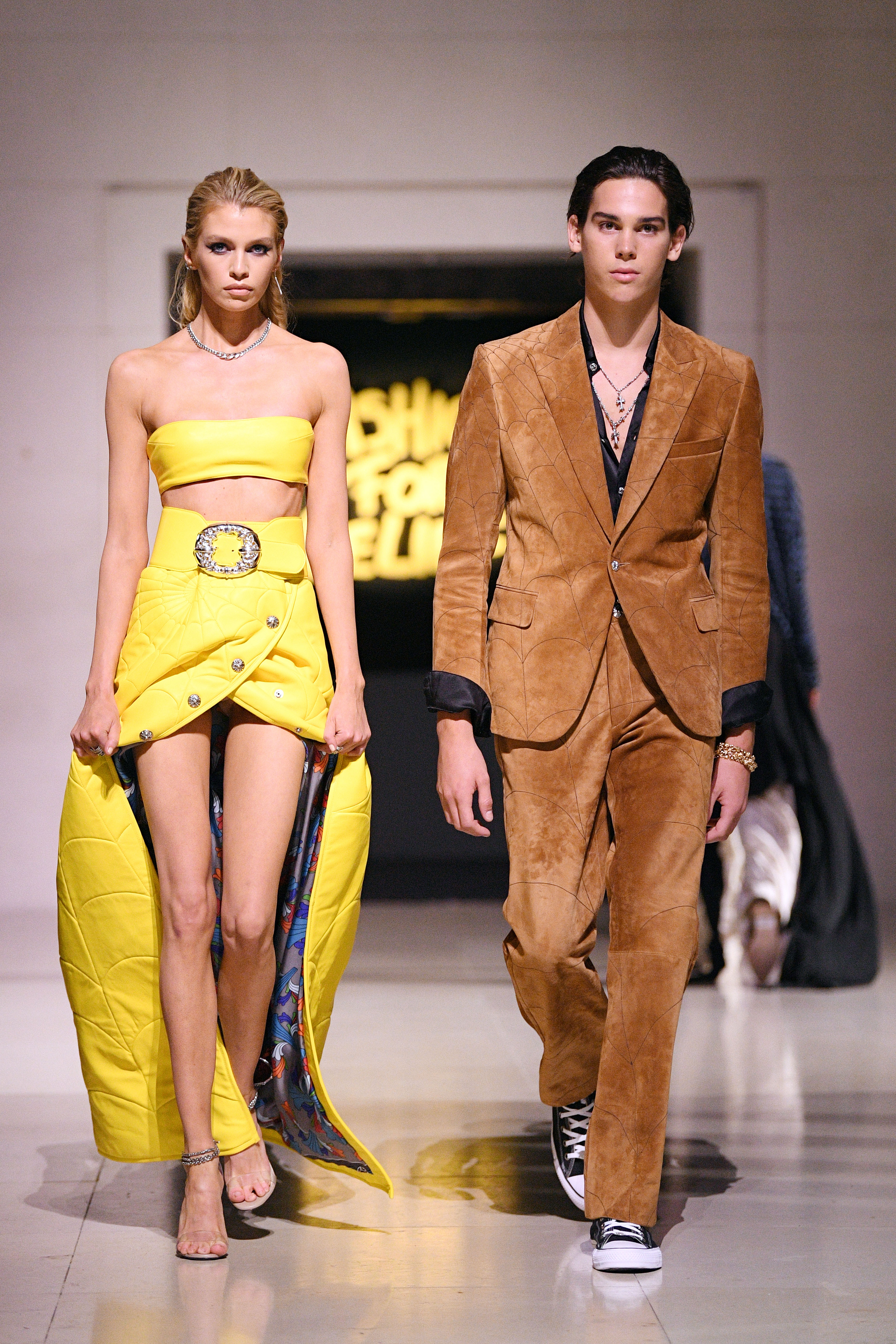 Stella Maxwell and Paris Brosnan walk the runway at the Fashion For Relief catwalk show at The British Museum in London on September 14, 2019 | Source: Getty Images