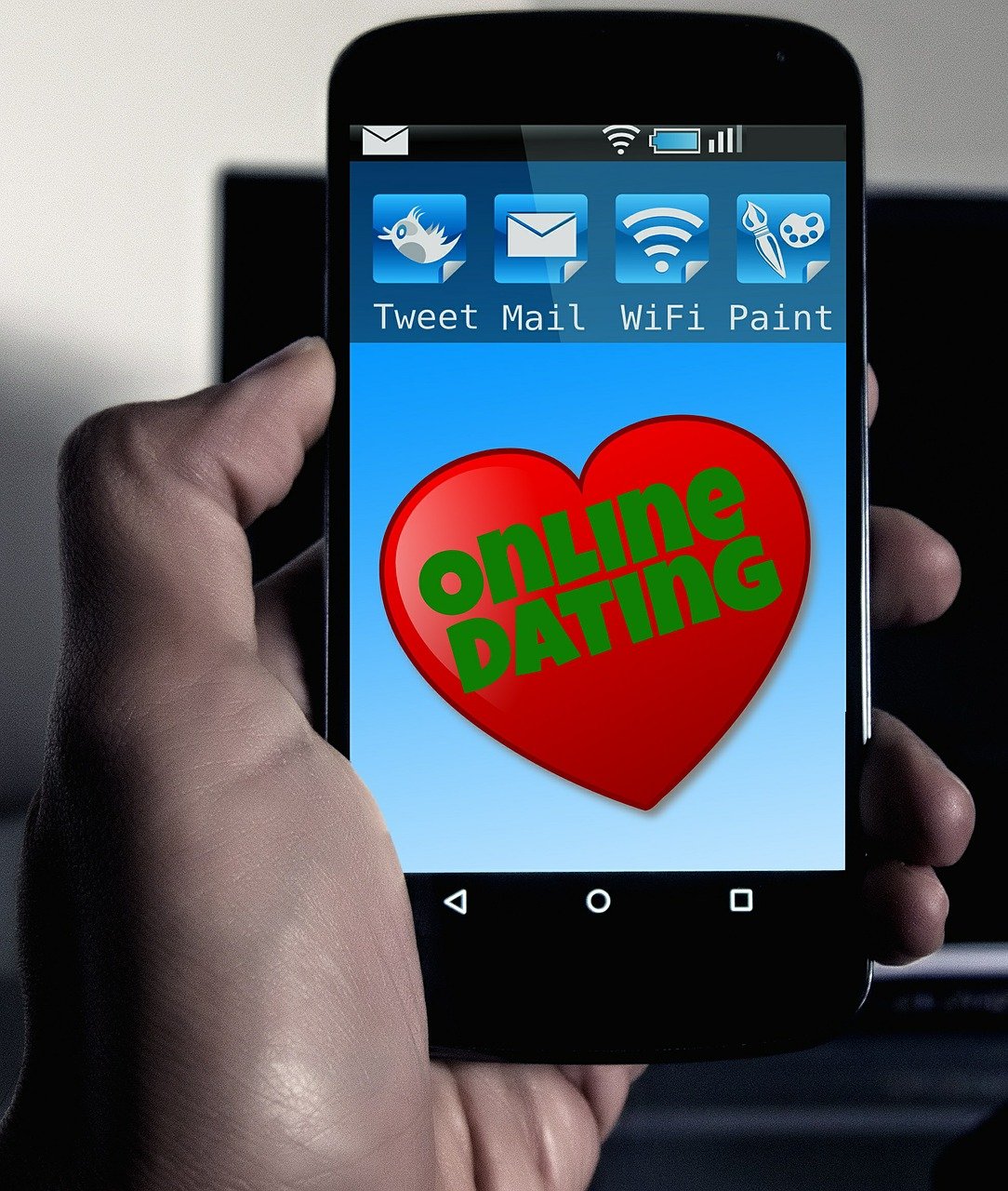 A picture of a phone with an online dating app. | Photo: Pixabay