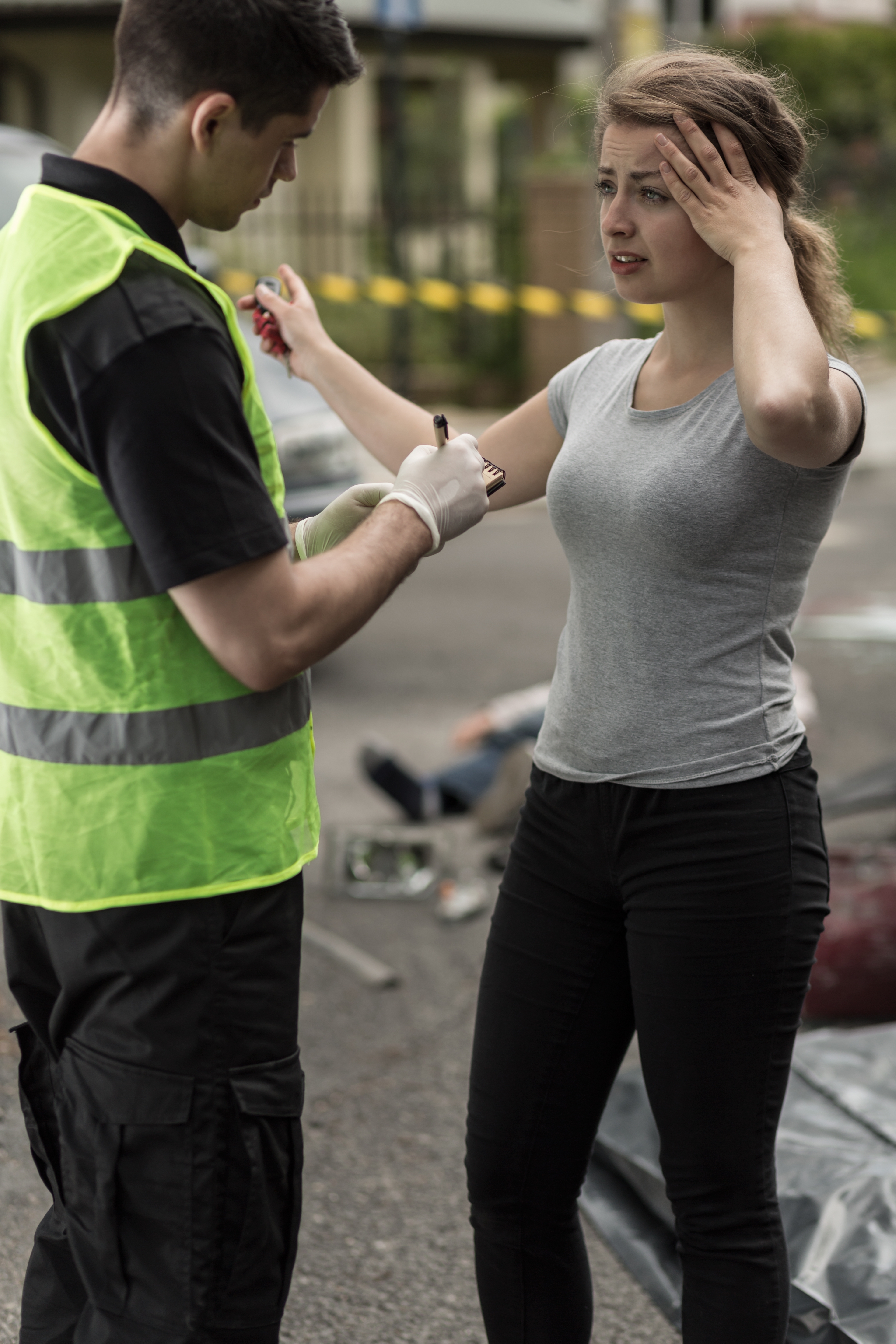 A woman giving a statement to a police officer. | Source: Shutterstock