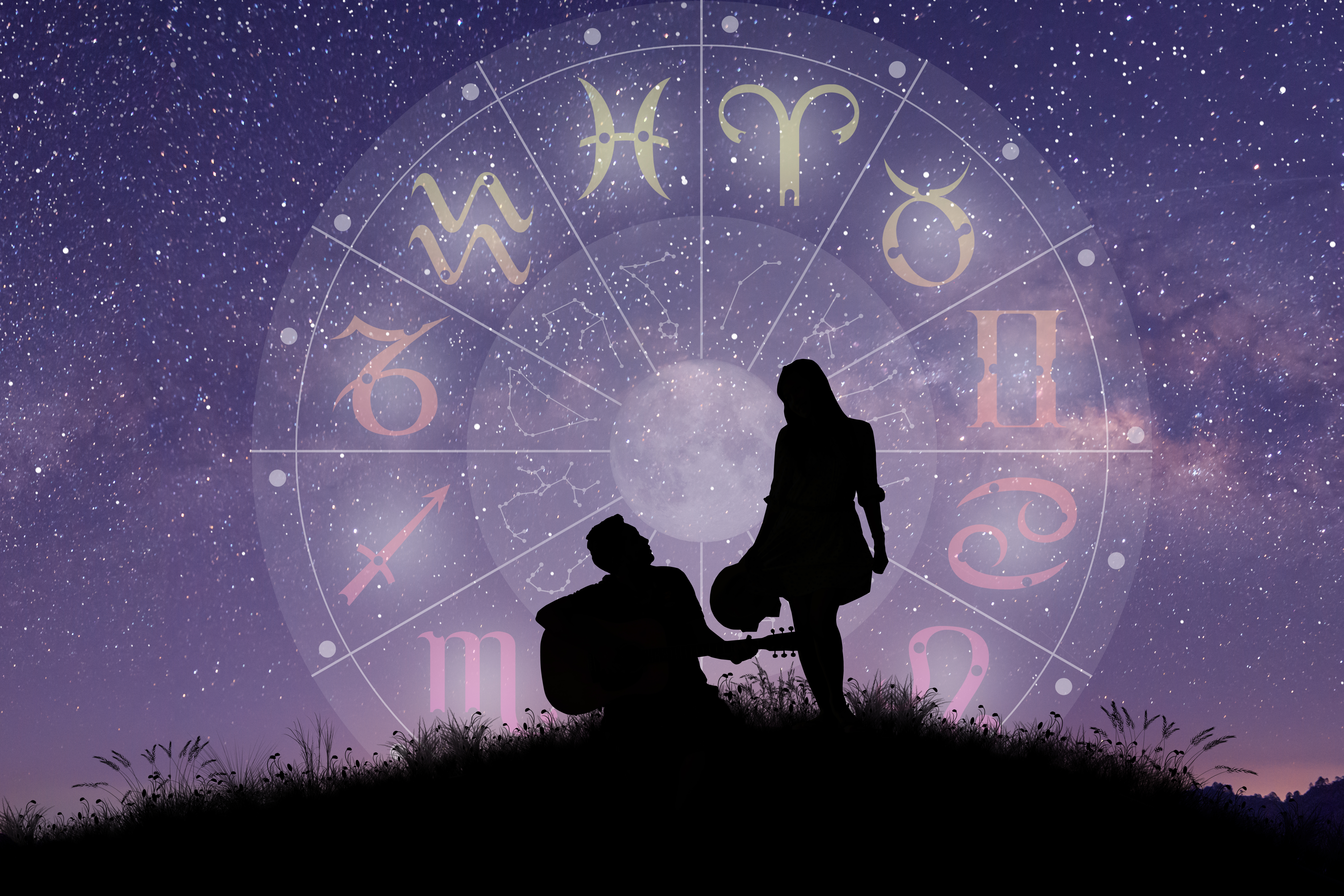 A couple singing and dancing over the zodiac wheel. | Source: Shutterstock