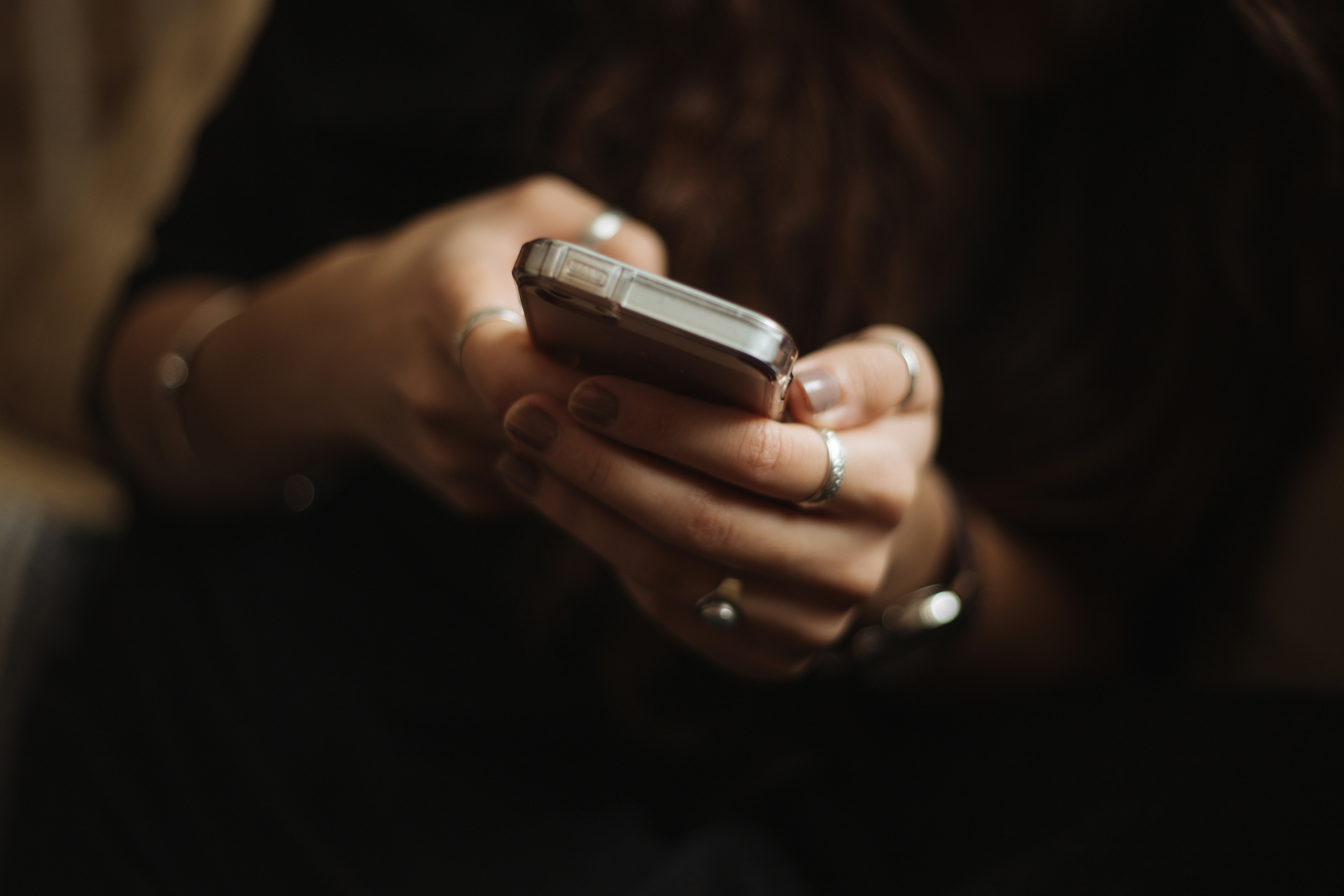 Woman checking her phone | Source: Unsplash