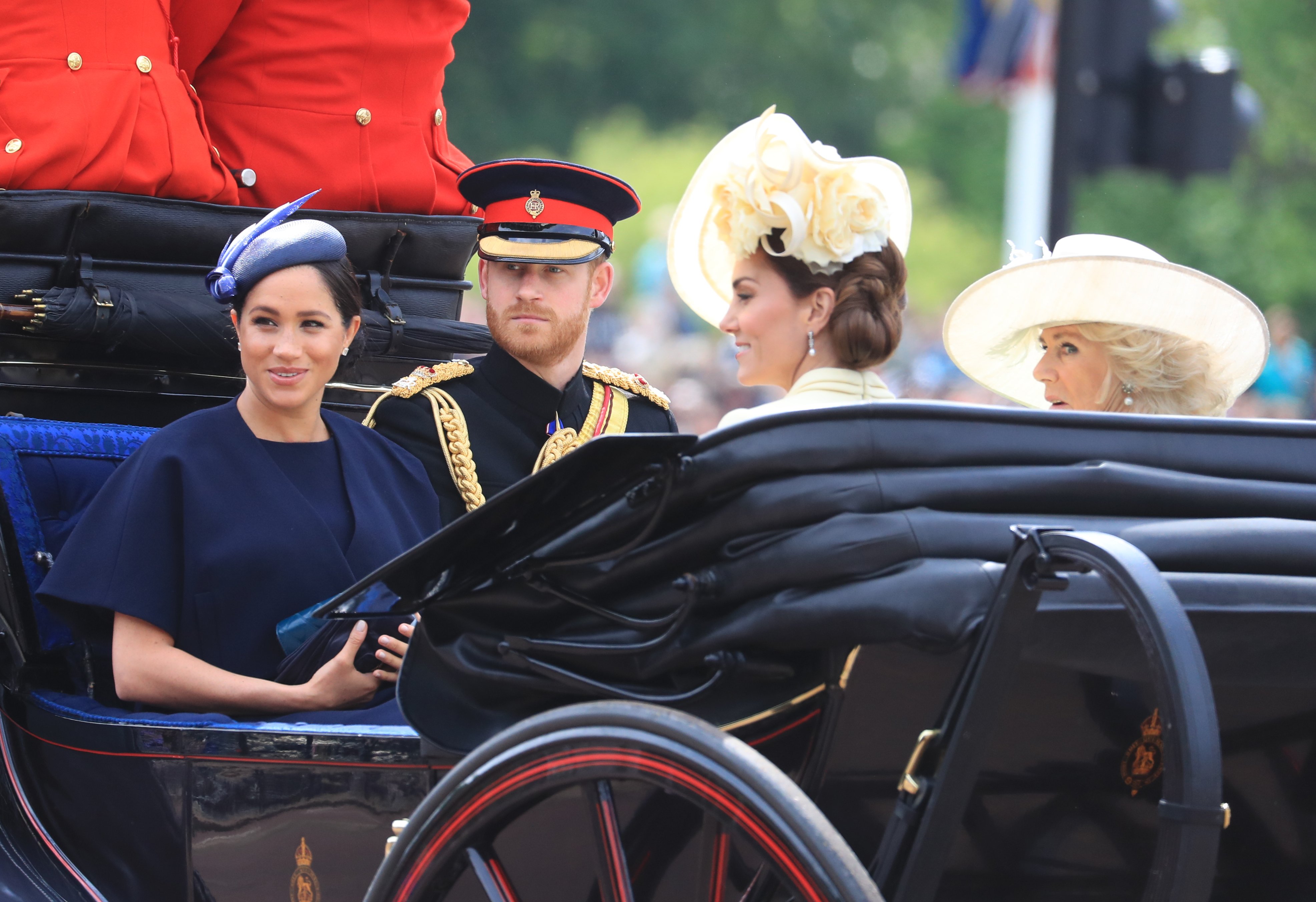The Duke and Duchess of Sussex, with the Duchess of Cambridge and the Duchess of Cornwall, make their way along The Mall to Horse Guards Parade in London, ahead of the Trooping the Colour ceremony, as The Queen celebrates her official birthday. | Source: Getty Images