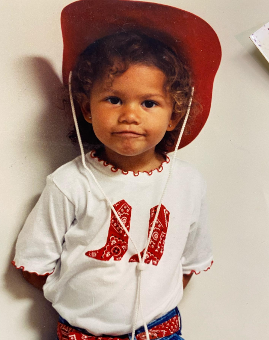 She was an adorable child, but no one could have predicted how she would become a multi-talented singer, dancer, actress, and model. In this photo, she posed in a cowboy costume in a throwback image uploaded on September 2, 2020. | Source: Instagram/zendaya