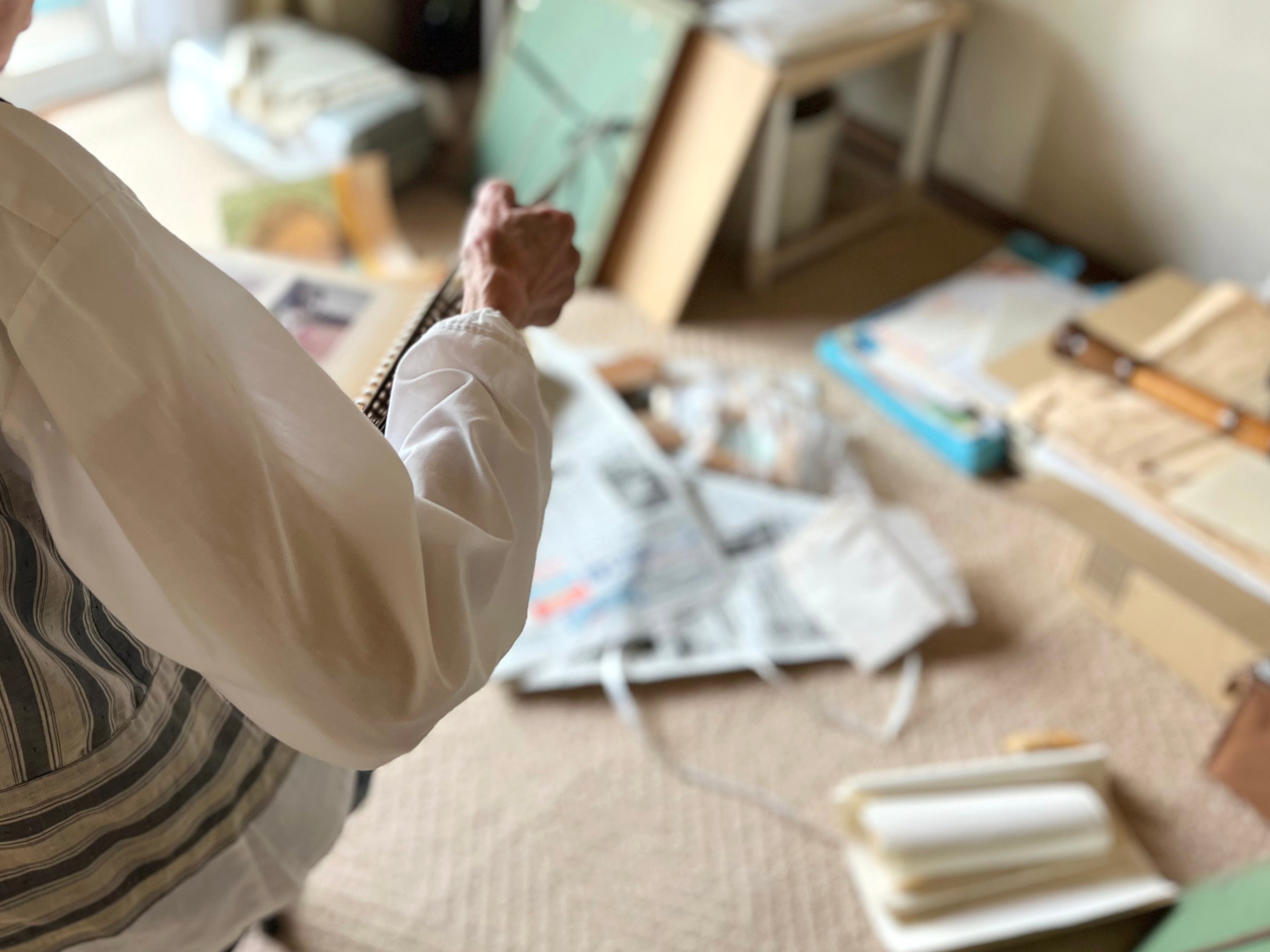 Senior woman decluttering her space | Source: Shutterstock