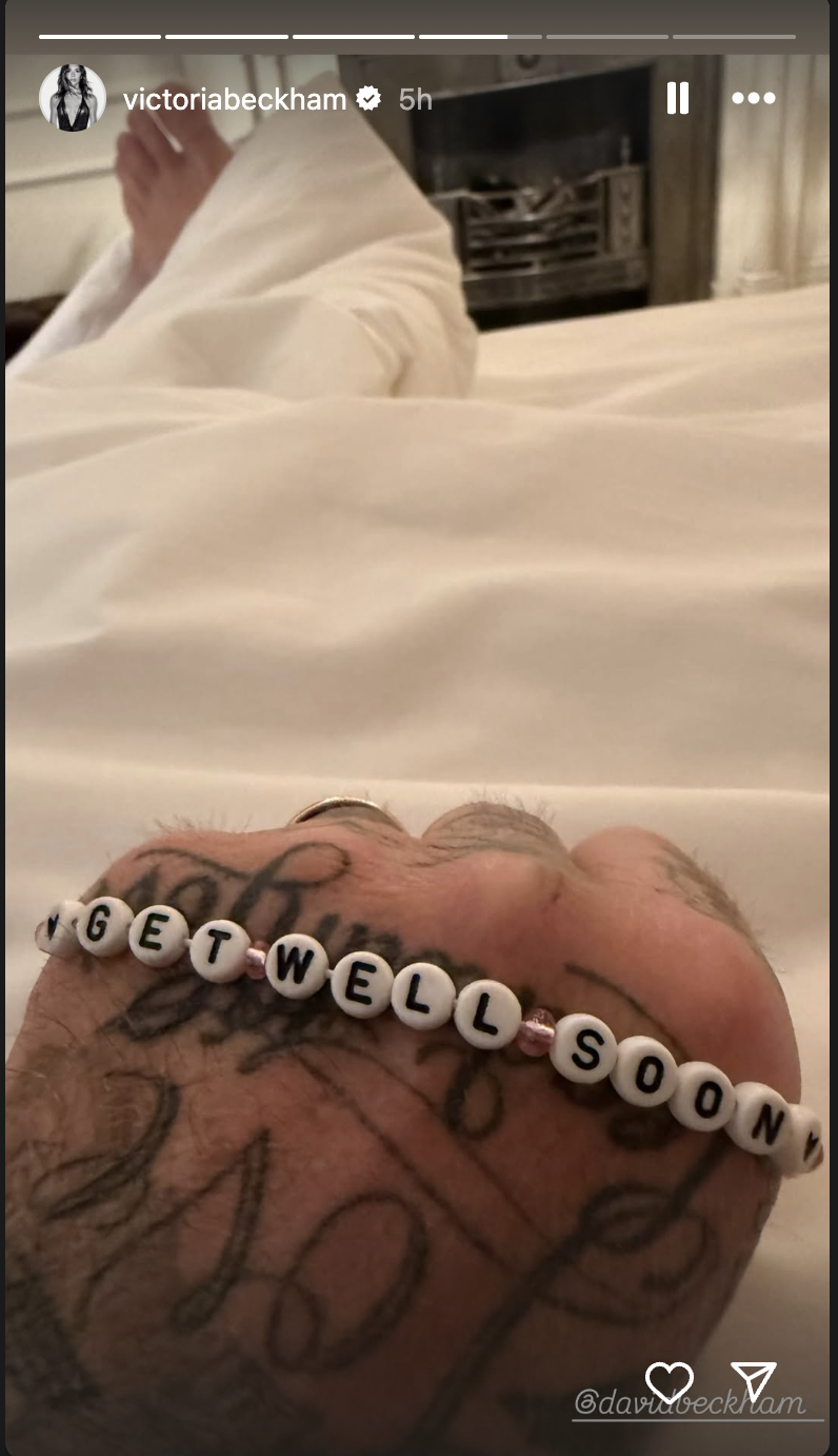 A close-up of David Beckham's hand with his "Get well soon" bracelet. | Source: Instagram/victoriabeckham