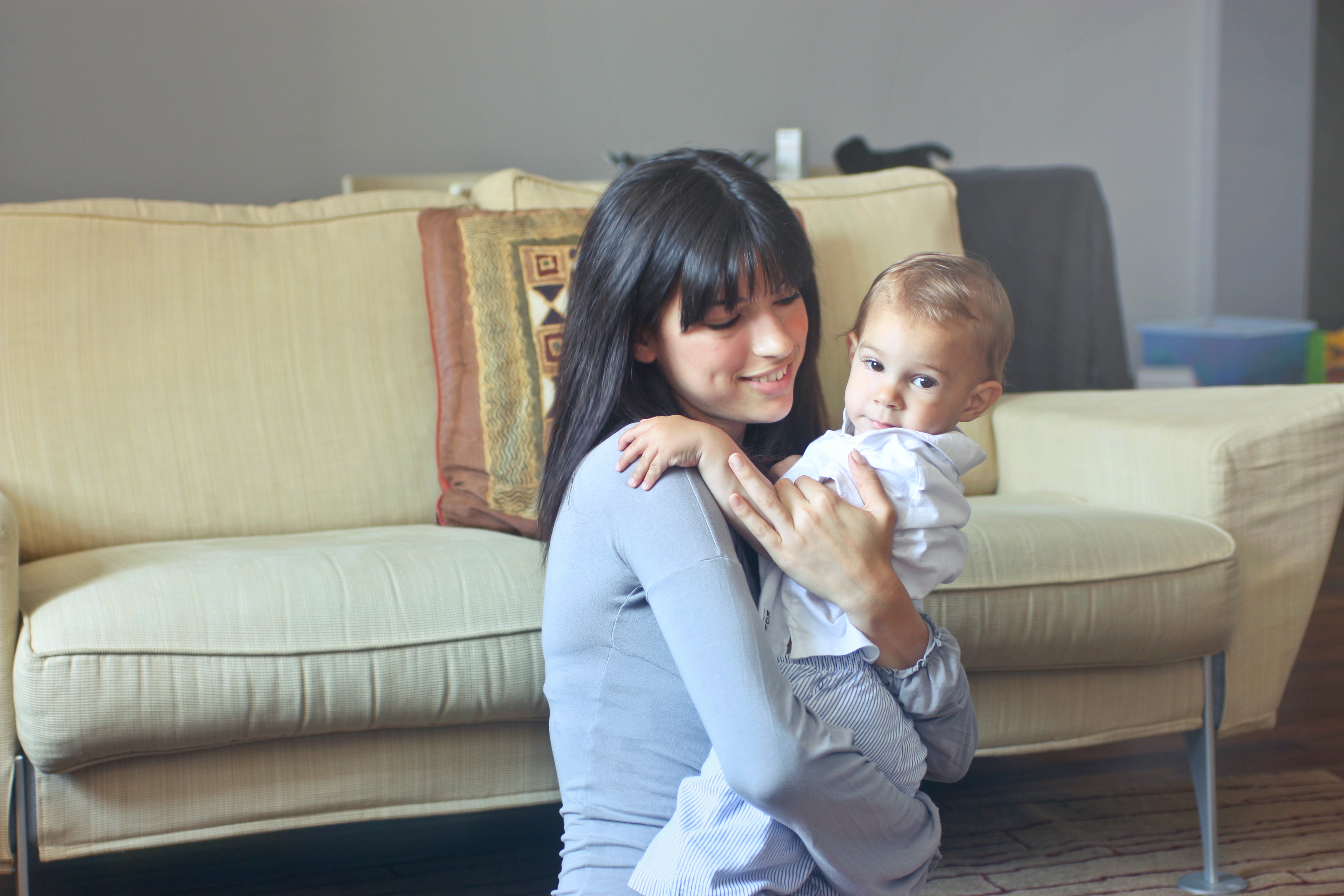 A woman cradling a baby | Source: Pexels