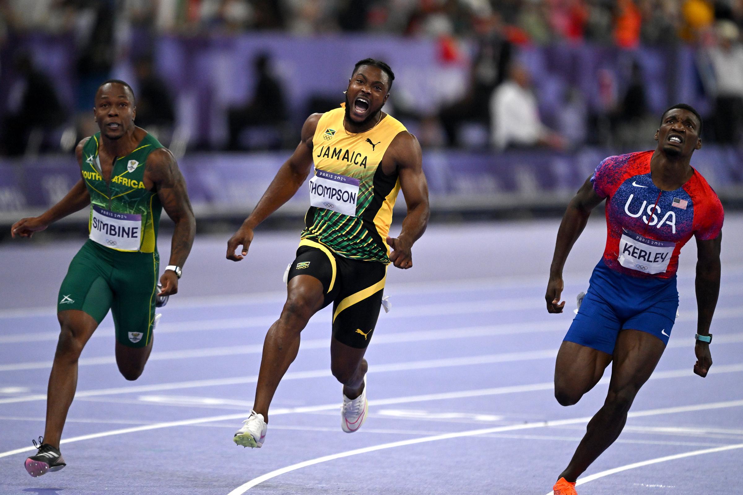 Kishane Thompson (c) reacts after the Men’s 100m Final during the Athletics on day nine of the Olympic Games Paris 2024 in Paris, France, on August 4, 2024. | Source: Getty Images