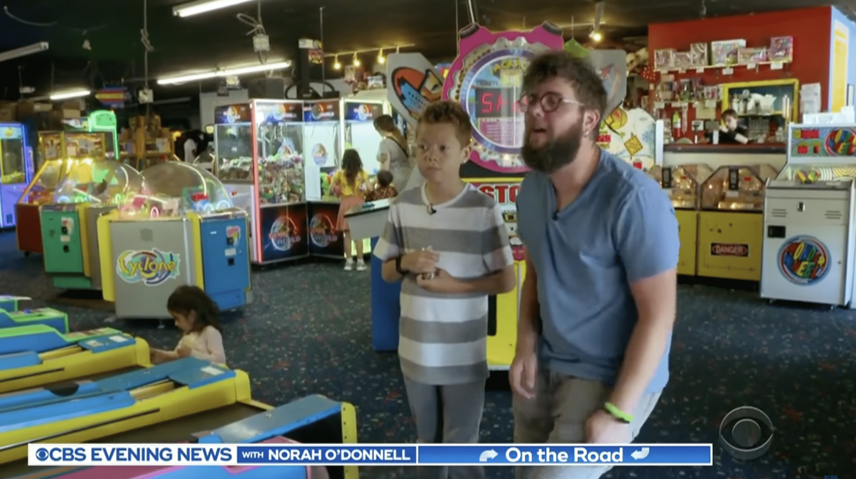 Damien enjoys playing sports and engaging in other fun activities with his foster father, Lanning. | Photo: YouTube.com/CBS Evening News