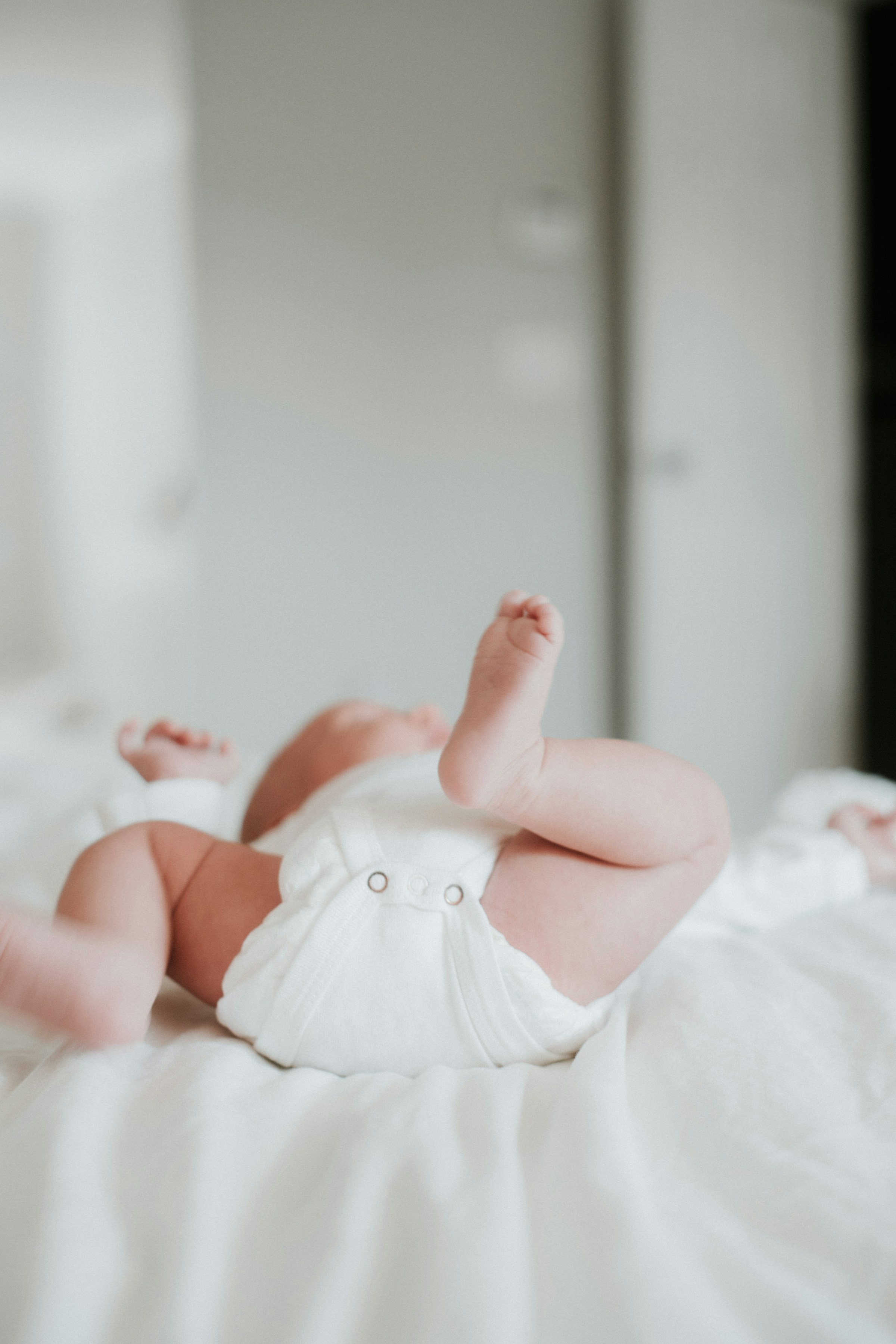 A baby on a bed | Source: Unsplash