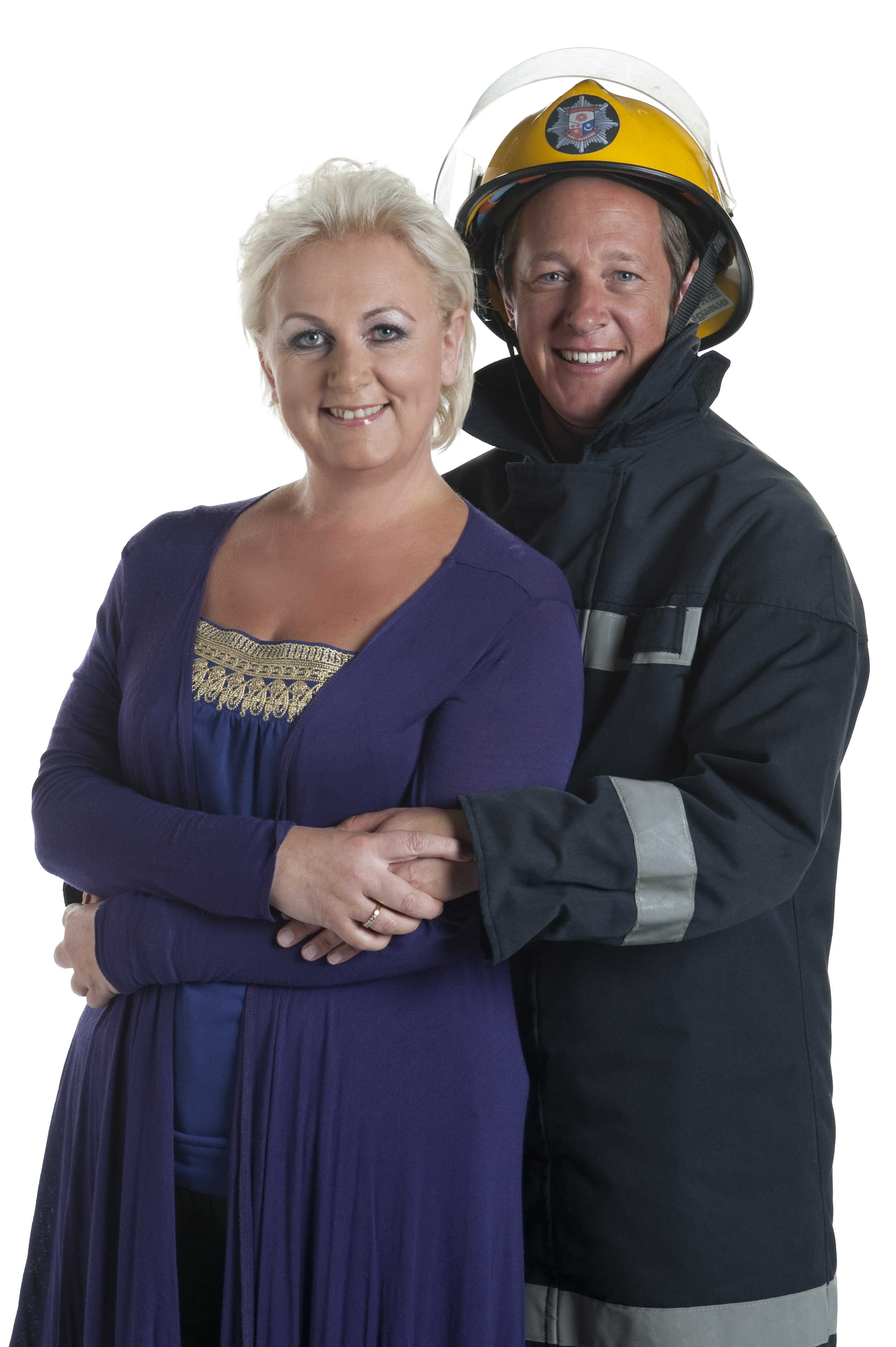 Cleaver poses in character as Eileen Grimshaw alongside co-star Tony Hirst, who is suited up in full firefighter gear as her on-screen love interest Paul Kershaw — a promotional shot from the same year she would collapse on set and receive her Type 2 Diabetes diagnosis.