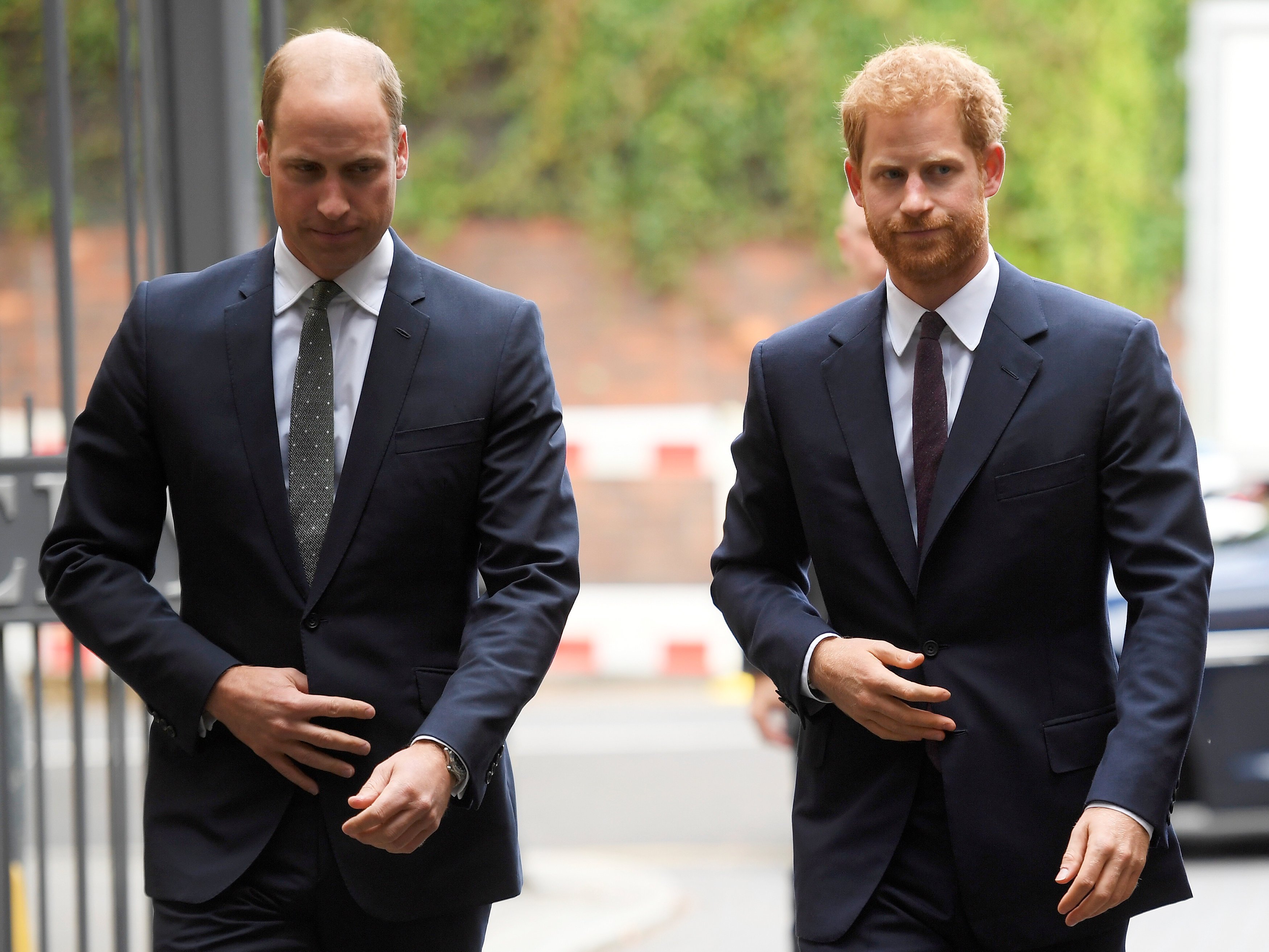 Prince William and Prince Harry arrive during a visit to the newly established Royal Foundation Support4Grenfell community hub on September 5, 2017 in London, England | Photo: Getty Images