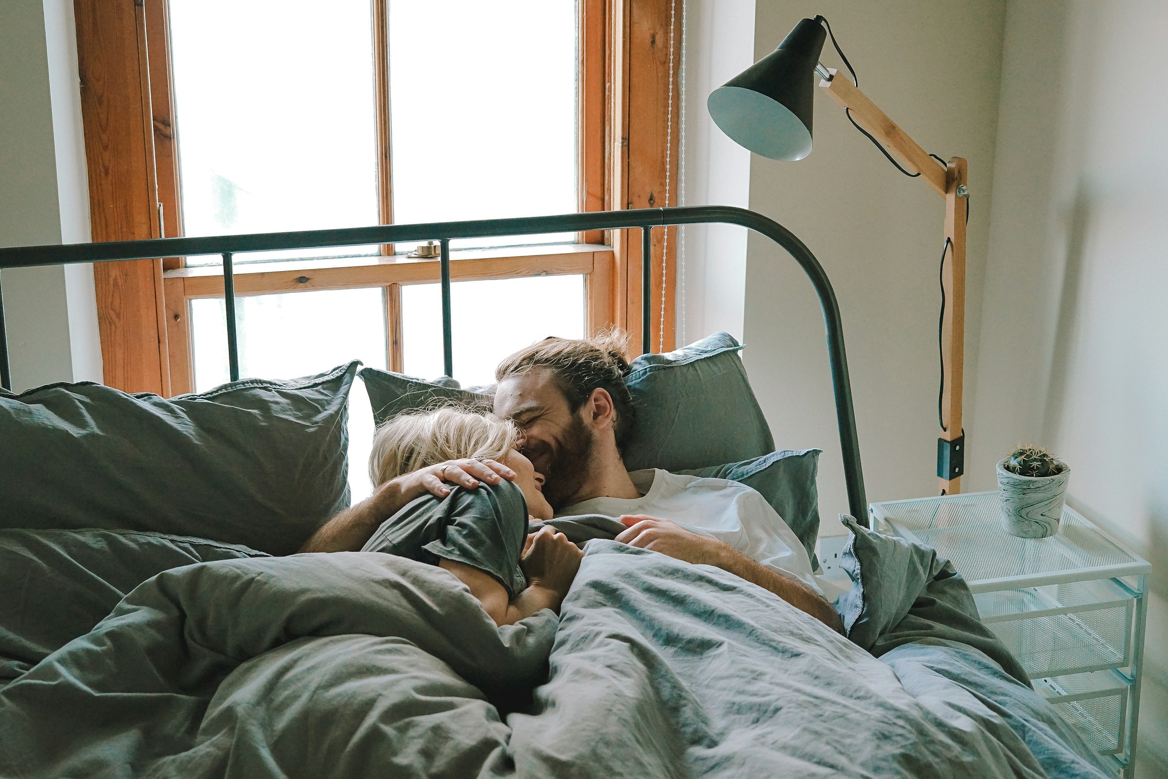 A couple in bed | Source: Unsplash