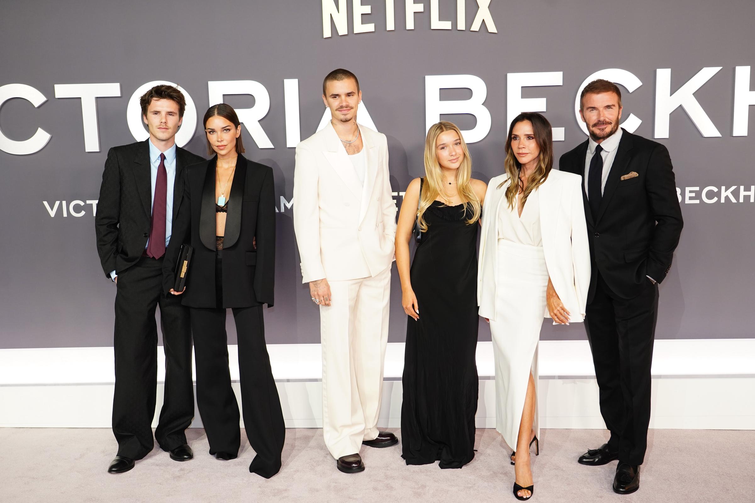 (L-R) Jackie Apostel, Cruz Beckham, Romeo Beckham, Harper Beckham, Victoria Beckham, and David Beckham attend the World Premiere of "Victoria Beckham" at The Curzon Mayfair on October 8, 2025, in London, England. | Source: Getty Images
