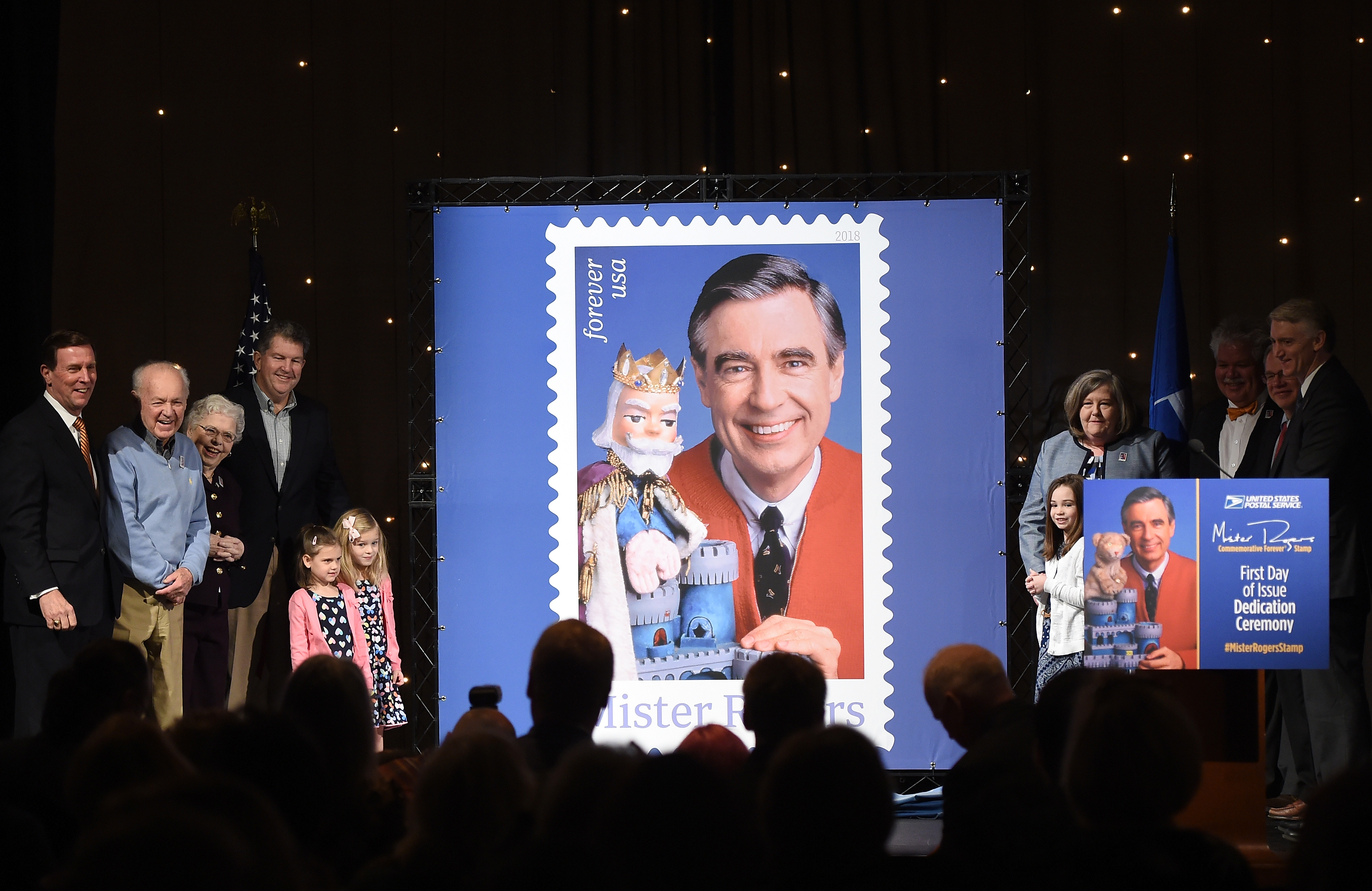 Joanne Rogers poses for a photo with other family members during the U.S. Postal Service Dedication of the Mister Rogers Forever Stamp at WQED's Fred Rogers Studio on March 23, 2018, in Pittsburgh, Pennsylvania. | Source: Getty Images