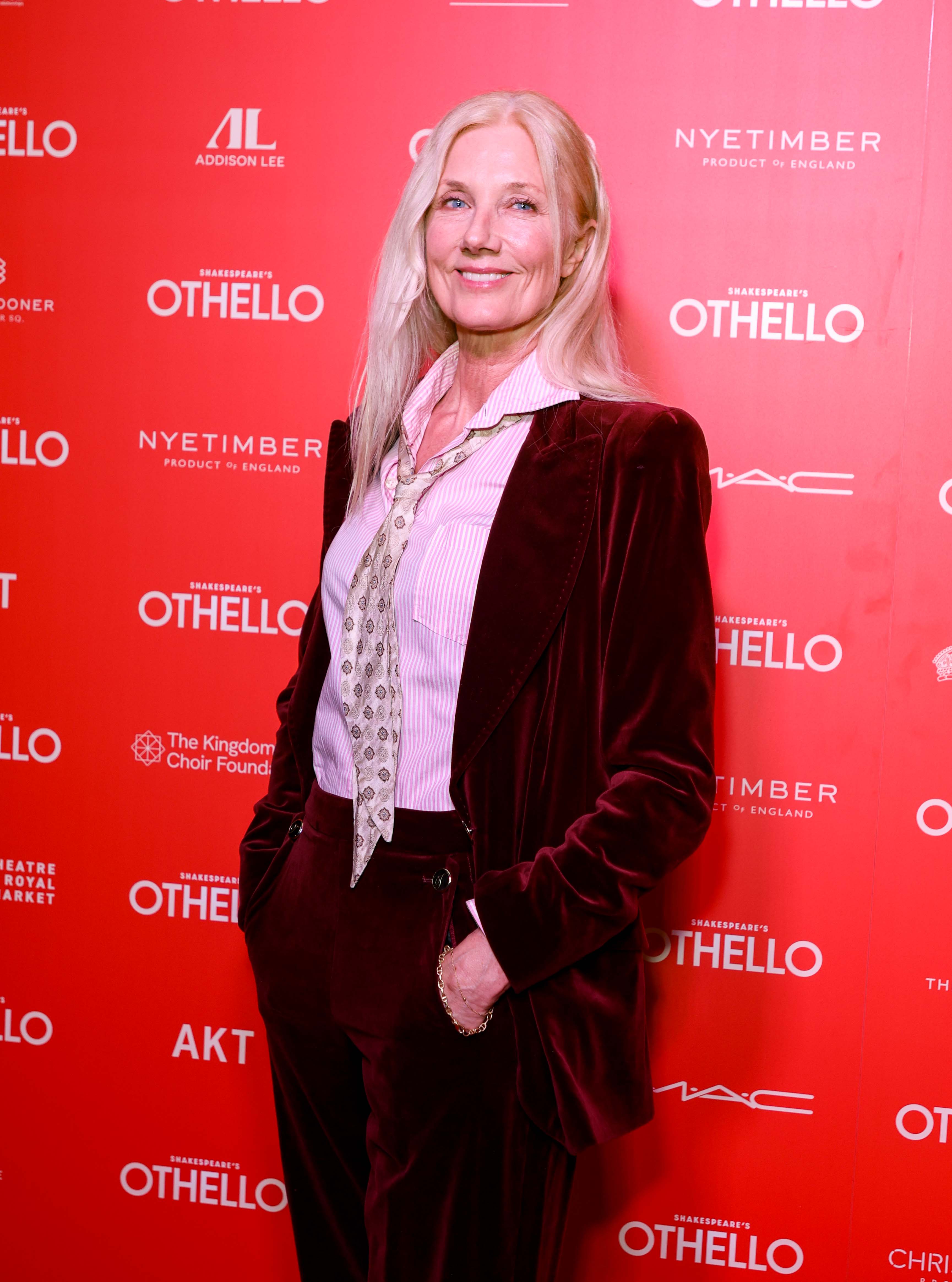 Richardson embraced vintage flair at the opening night of “Othello” on November 27, 2025, in London, England. Dressed in a wine-colored velvet suit paired with a patterned tie and striped shirt, she wore her long silver-blonde hair loose, exuding timeless confidence and a bohemian spirit.