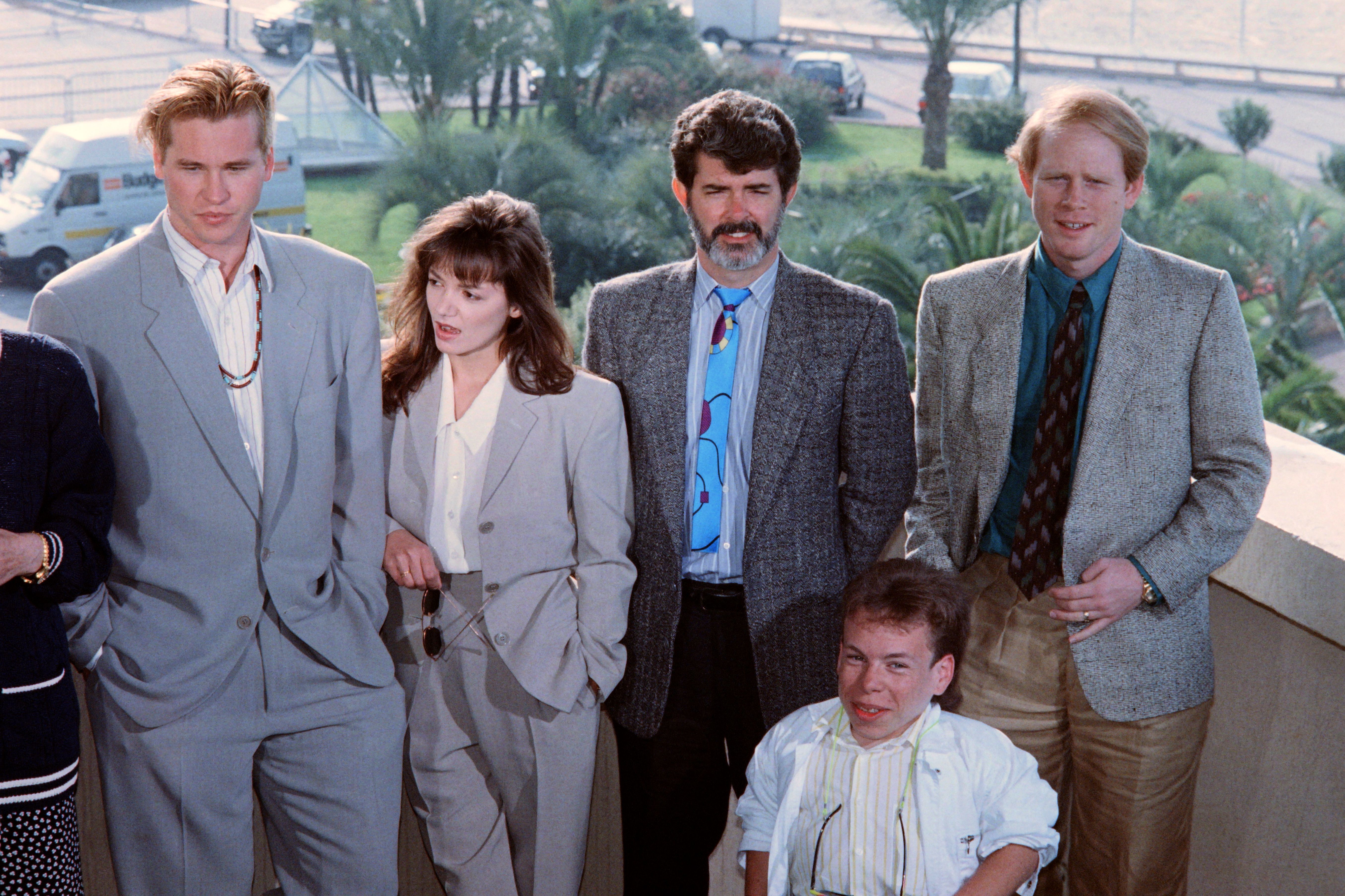 (L- R) Val Kilmer, the actress, George Lucas, Ron Howard and Warwick Davis pose during a photocall for the movie "Willow" on May 23, 1988, in Cannes, France. | Source: Getty Images