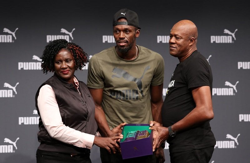 Usain Bolt with his parents, Jennifer and Wellesley Bolt, at The Brewery, in London, United Kingdom in August 2017 | Photo: Getty Images
