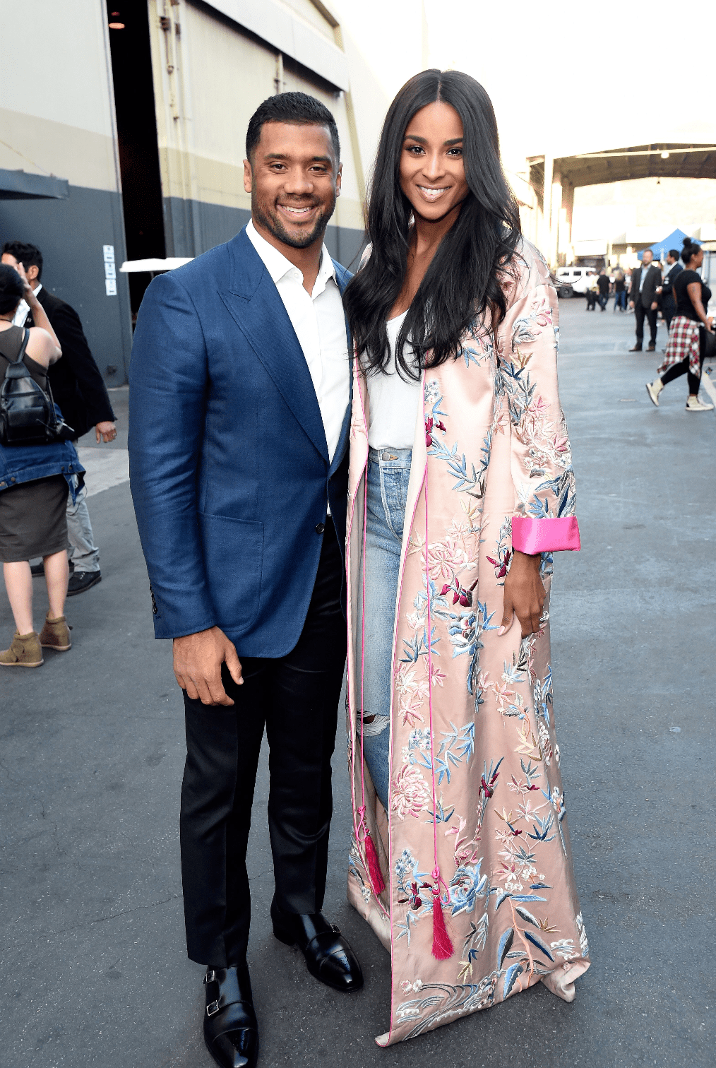 NFL player Russell Wilson and singer Ciara pose backstage during "One Voice: Somos Live! A Concert For Disaster Relief" at the Universal Studios Lot on October 14, 2017. | Source: Getty Images