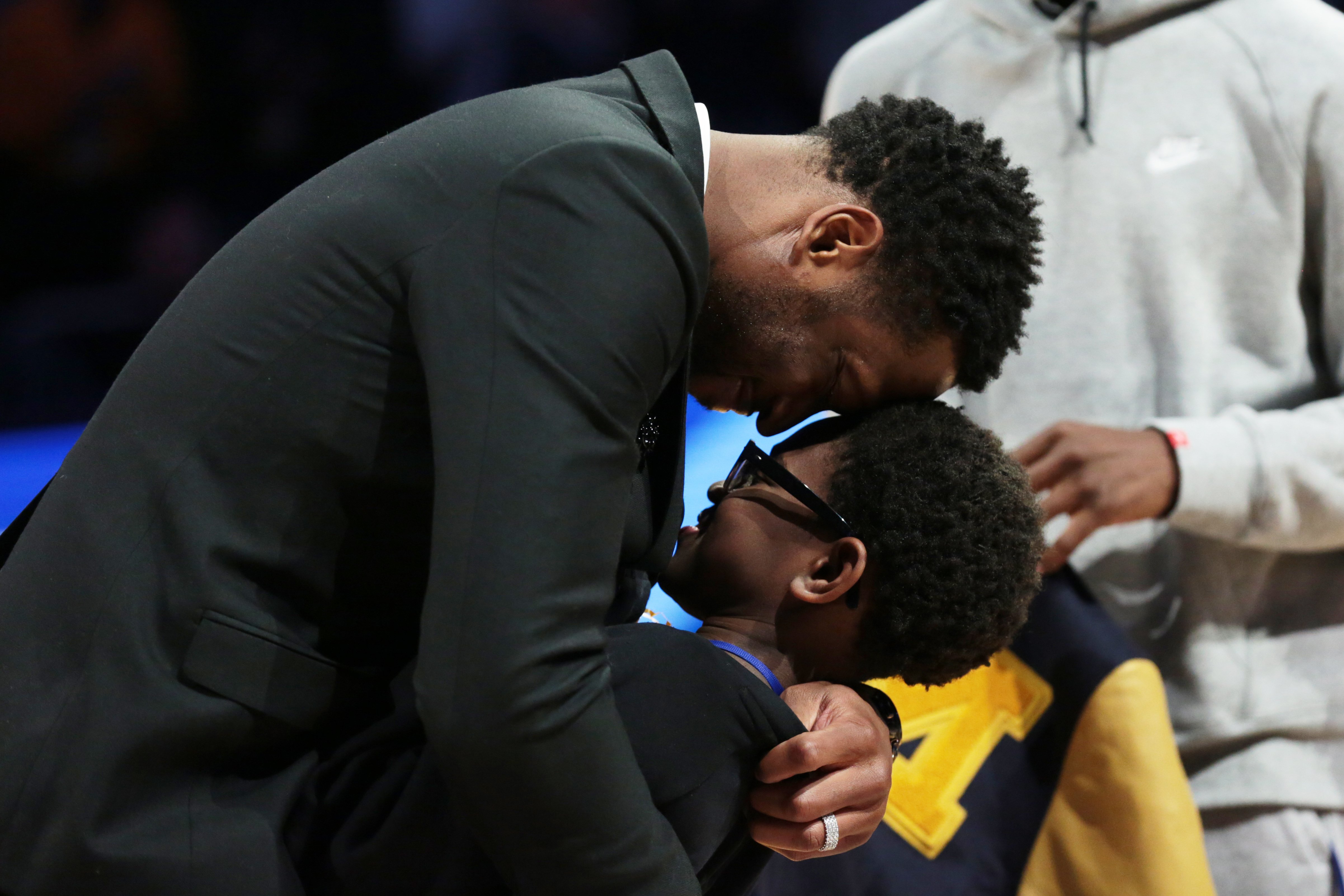 Dwyane Wade embraces his son Xavier during a game between the Marquette Golden Eagles and the Providence Friars on January 20, 2019, in Milwaukee, WI. | Source: Getty Images