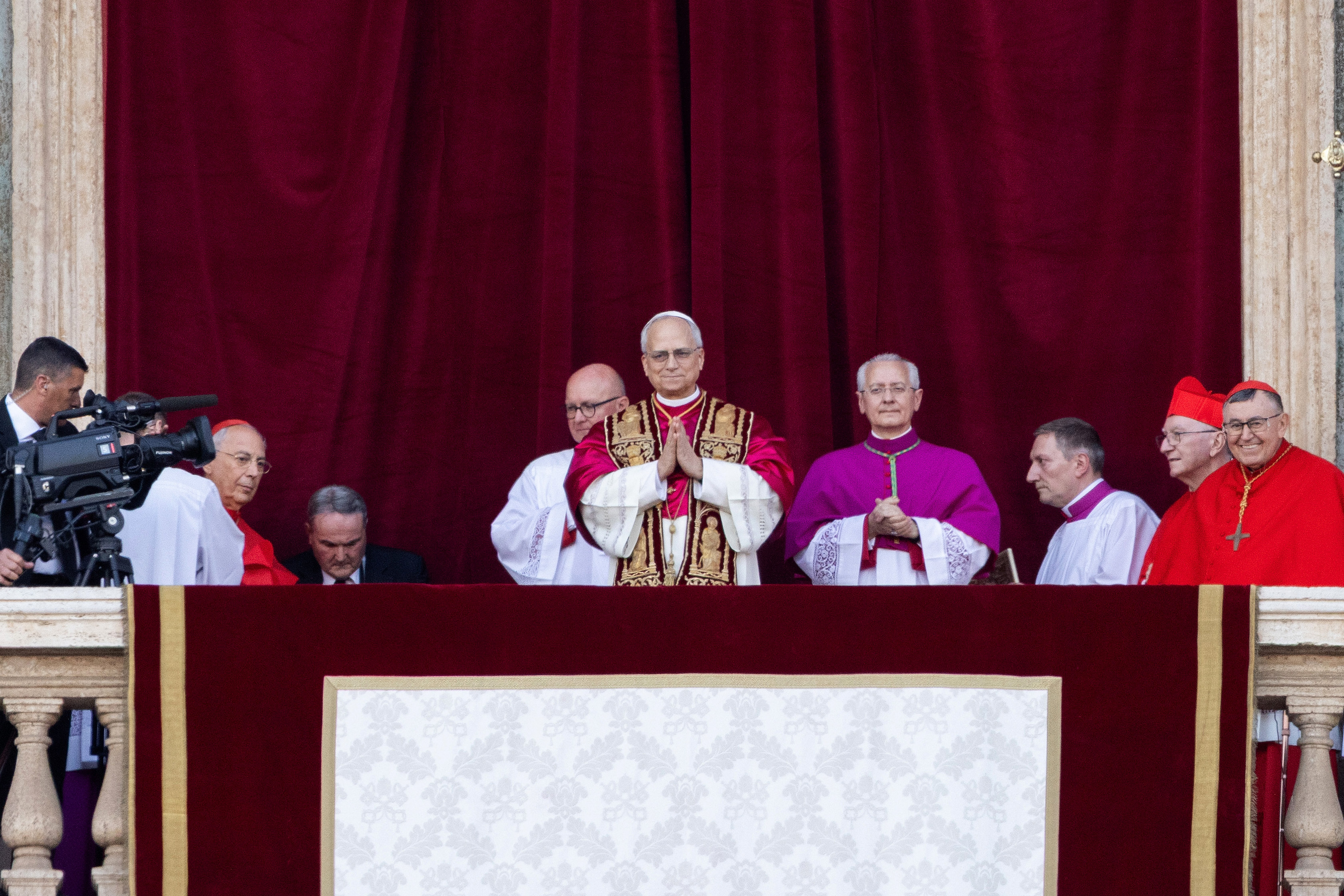 Cardinals gather in Vatican City as the newly elected Pope Leo XIV appears for the first time on the Vatican balcony on May 8, 2025 | Source: Getty Images