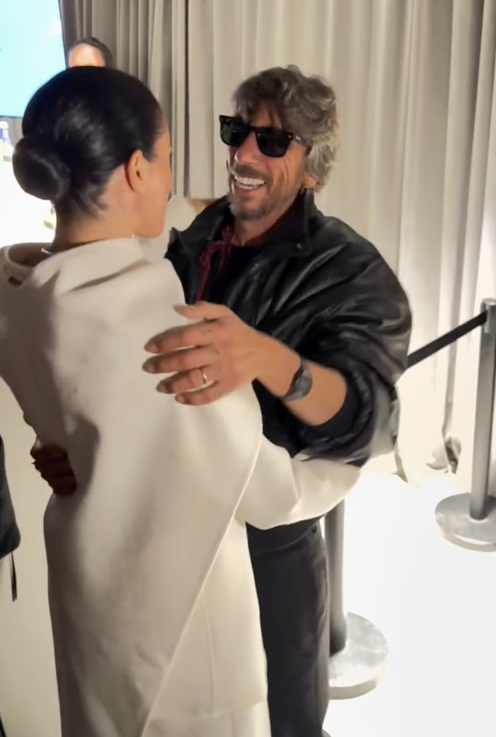 Meghan Markle is seen sharing a warm embrace with Pierpaolo Piccioli following his debut collection for Balenciaga at Paris Fashion Week. The Duchess of Sussex congratulates the newly appointed Creative Director, marking a heartfelt moment between longtime collaborators on the fashion stage.