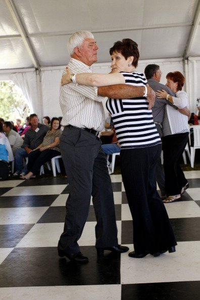 An ederly man and woman dancing together | Photo: Getty Images