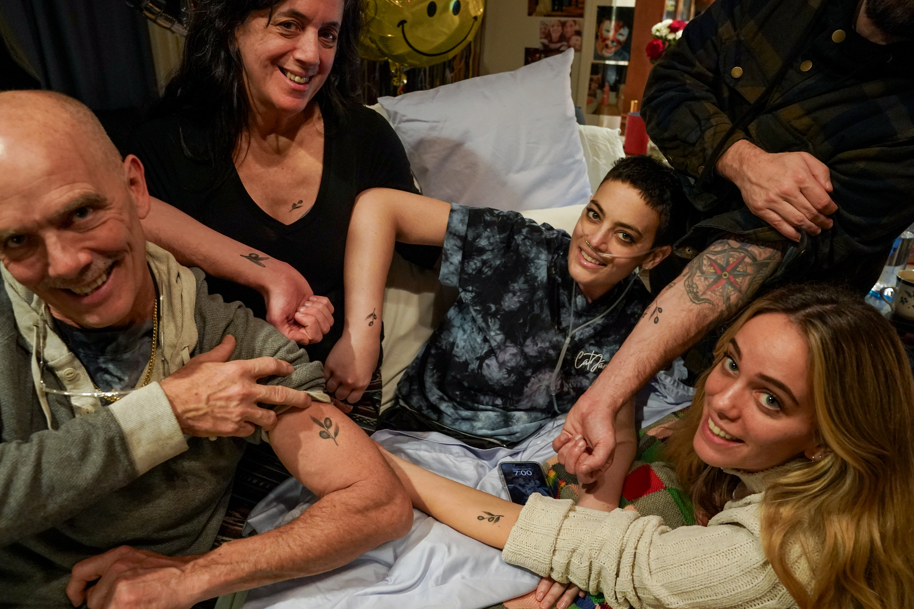 Cat Janice showing off matching tattoos with her family on January 25, 2024, in Annandale, Virginia. | Source: Getty Images