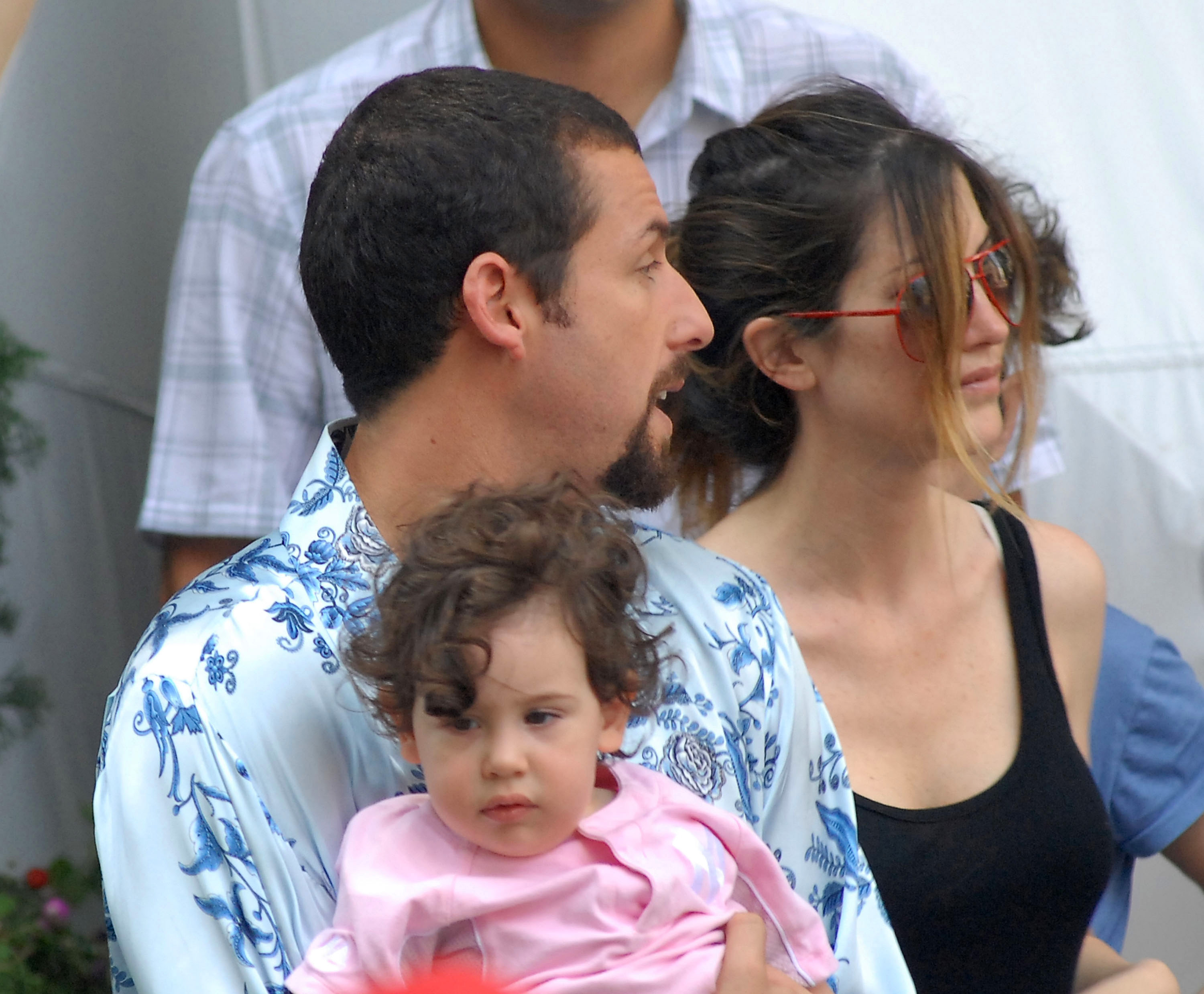 Adam Sandler, Jackie Sandler, and their then-one-year-old Sadie Sandler on the set of "You Don't Mess With The Zohan" at 54th Street and Park Avenue, on August 1, 2007, in New York City. | Source: Getty Images