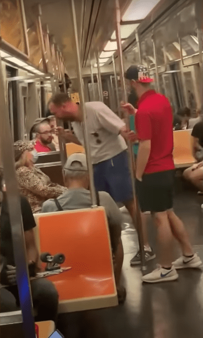 A 27-year-old man yelling at an elderly woman on the New York City subway. | Source:  youtube.com/InsideEdition