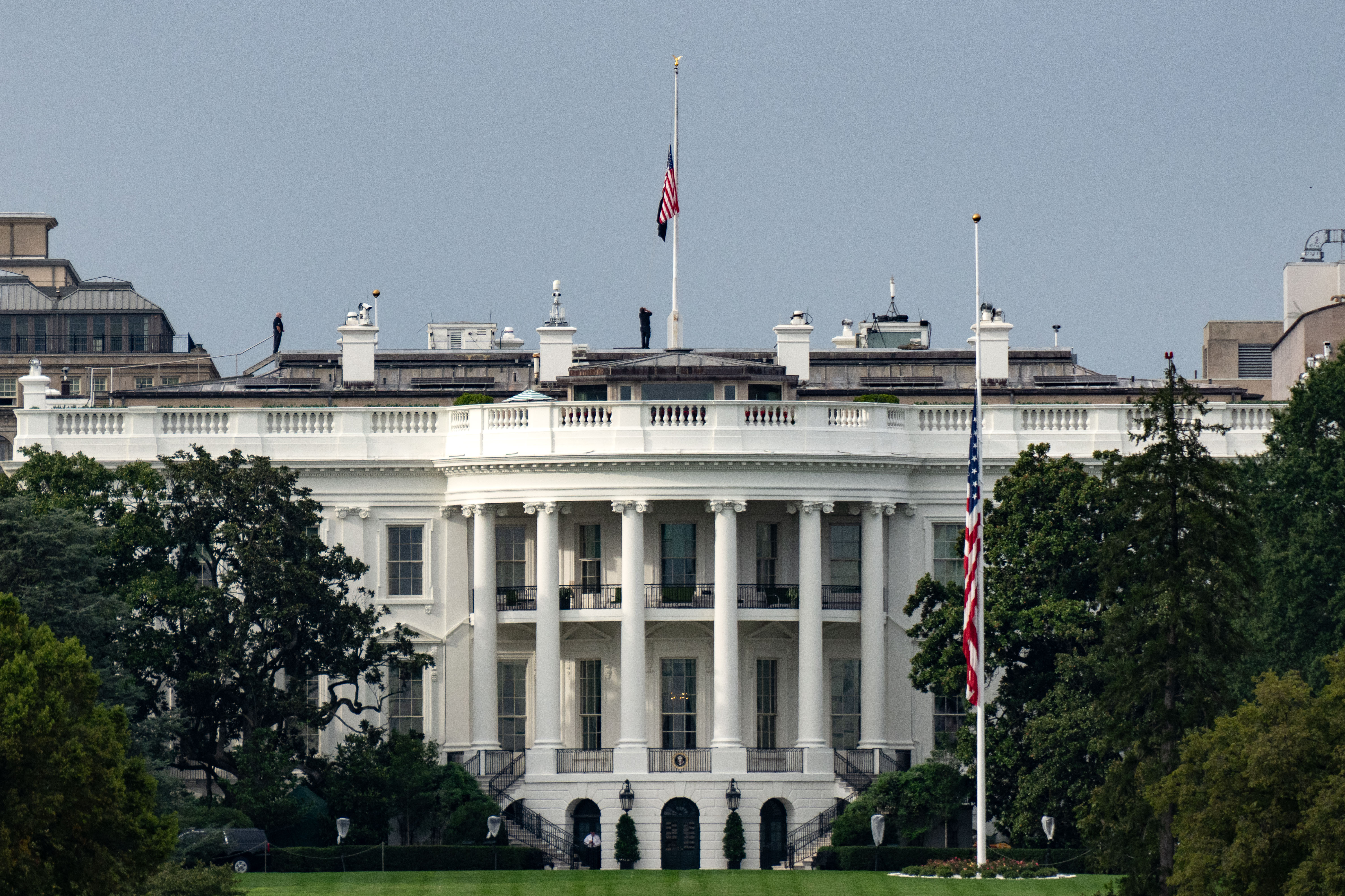 The U.S. flag flies at half-staff atop the White House on September 10, 2025, honoring the death of Charlie Kirk | Source: Getty Images