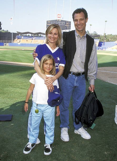 Actress Maureen McCormick, husband Michael Cummings, and daughter Natalie Cummings attend the 39th Annual "Hollywood Stars Night' Celebrity Baseball Game on August 16, 1997 at Dodger Stadium in Los Angeles, California | Source: Getty Images