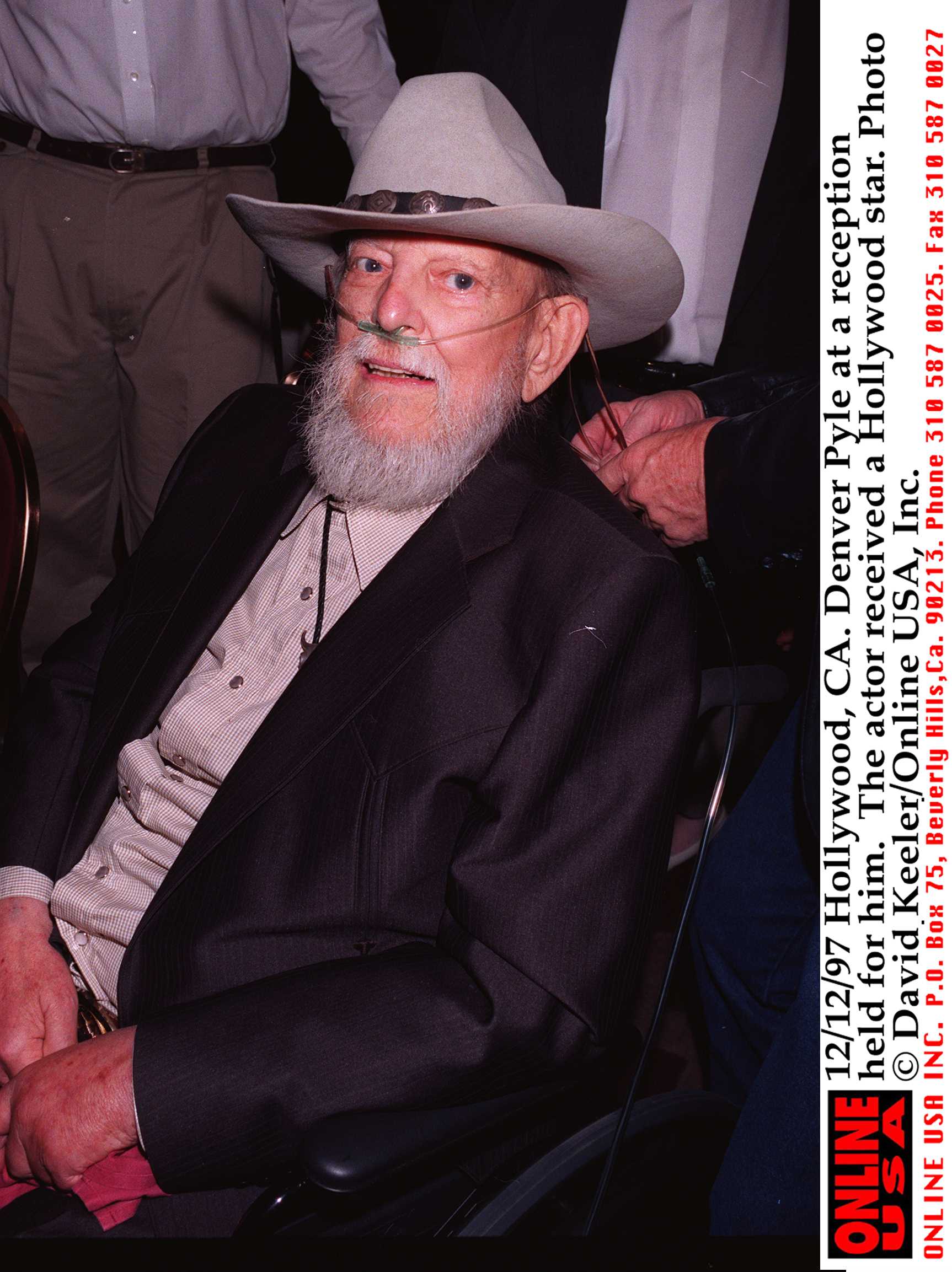 Pyle appeared in a cowboy hat and dark suit, seated in a wheelchair with supplemental oxygen in place. The late-career image shows a markedly different side of the actor from the rugged screen presence viewers knew from "The Dukes of Hazzard" and his Western roles. | Source: Getty Images