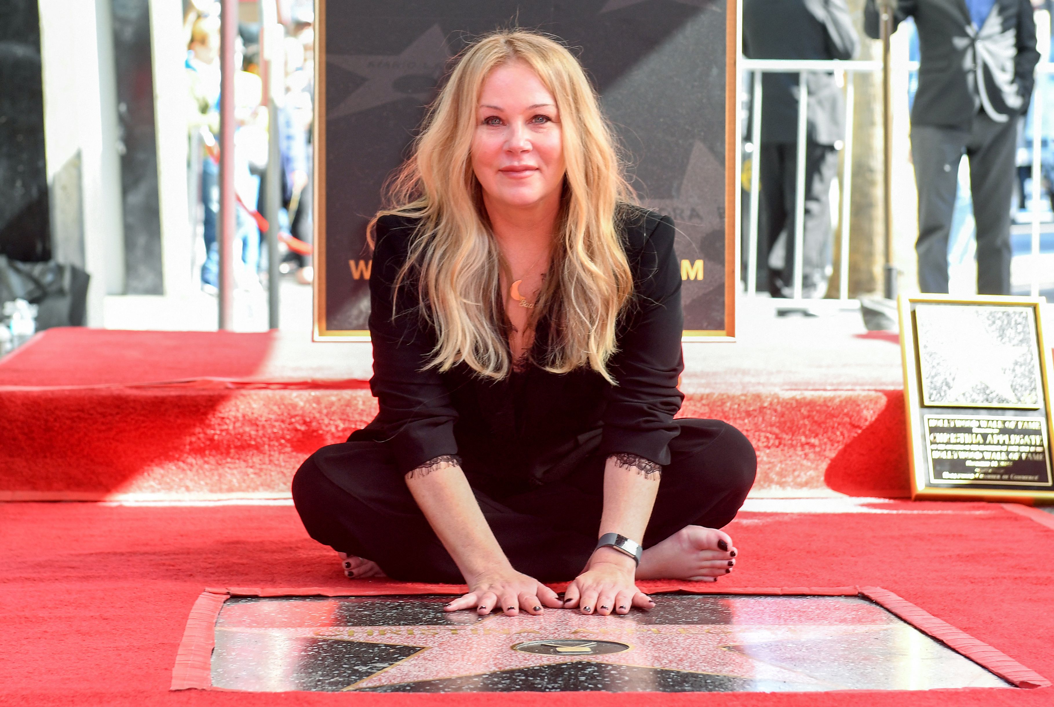 Christina Applegate poses with her star during the Hollywood Walk of Fame Ceremony in Los Angeles, California, on November 14, 2022. | Source: Getty Images