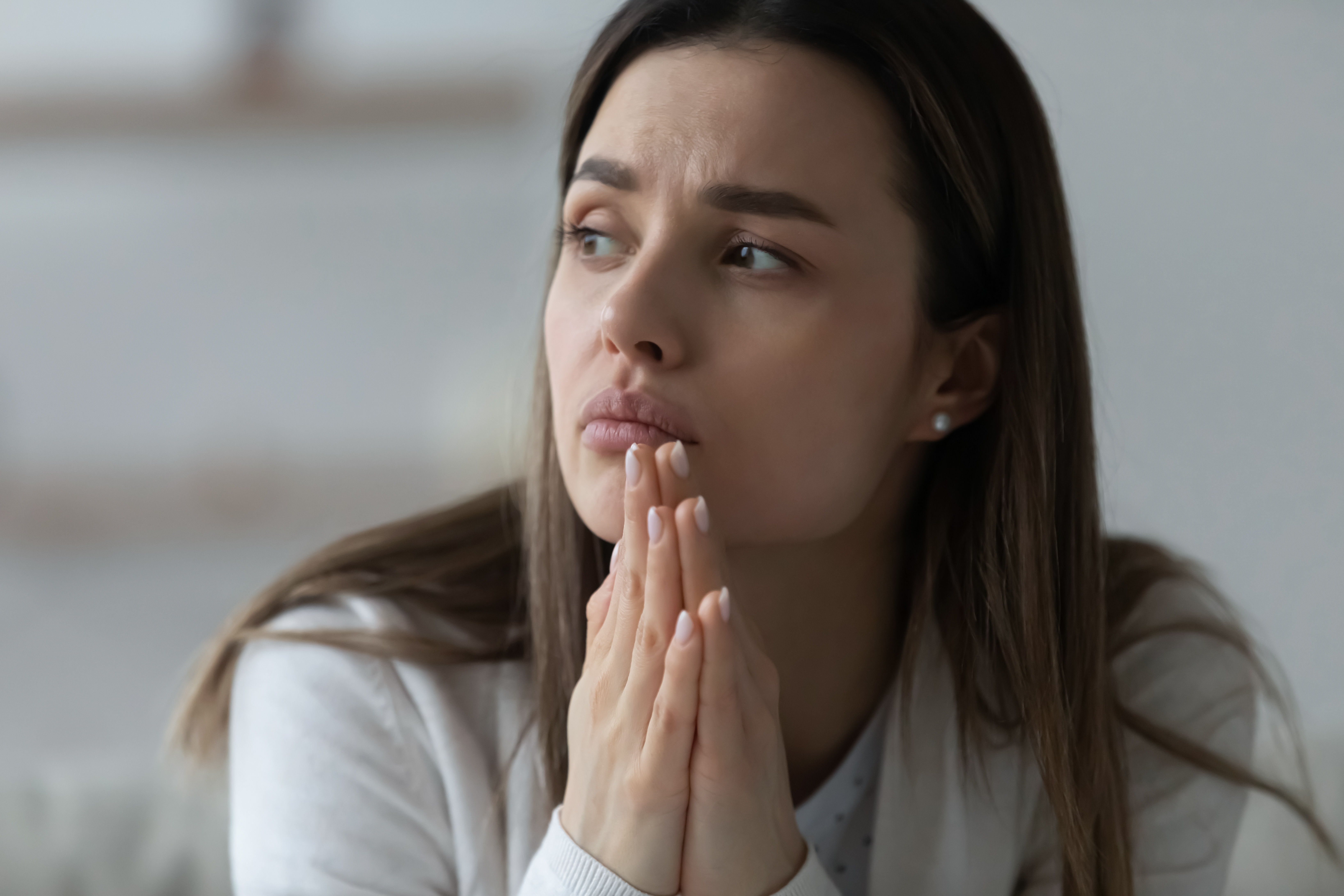 Upset thoughtful young woman | Source: Shutterstock