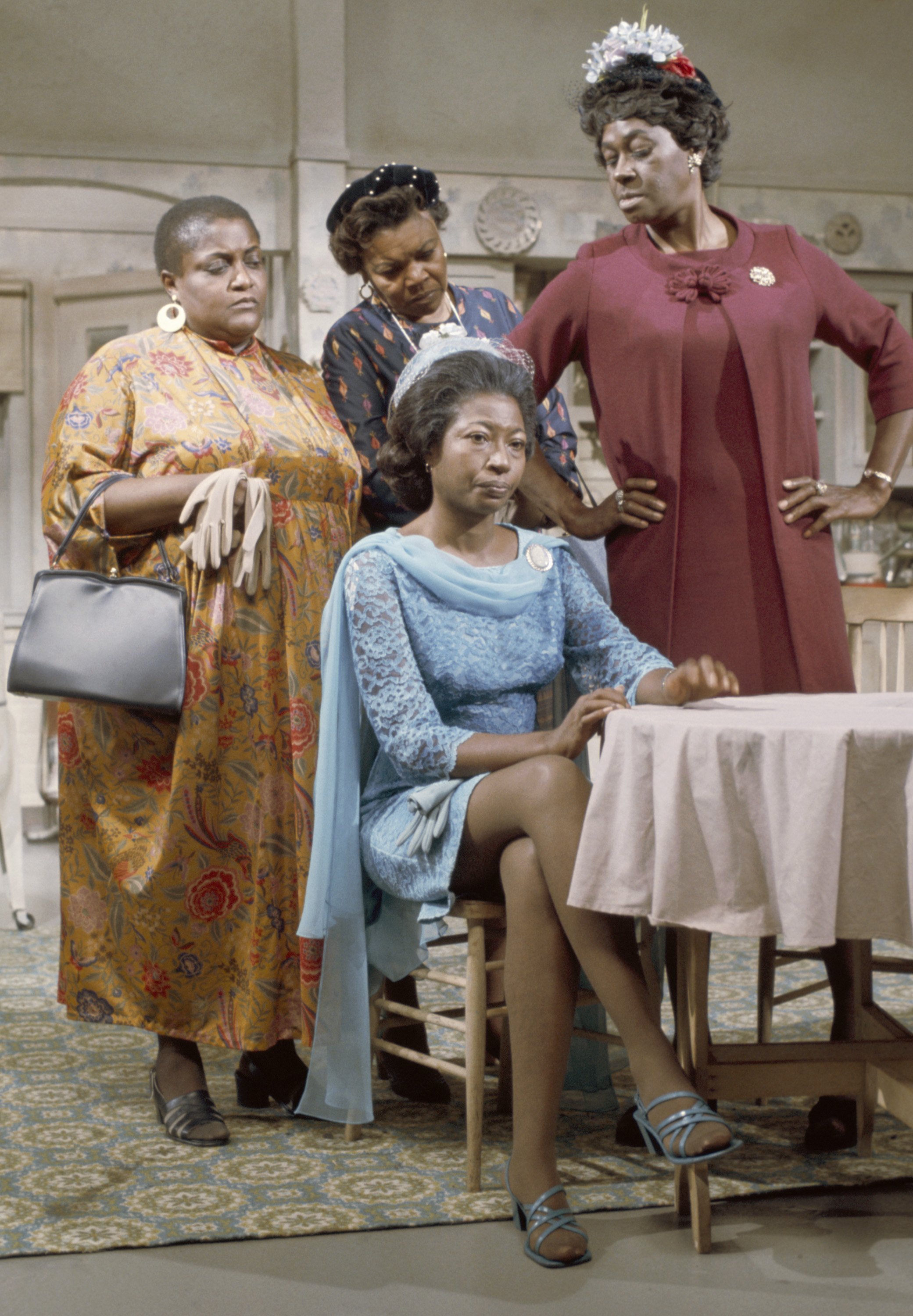 Lynn Hamilton (sitting) and LaWanda Page (front right) as their characters on "Sanford and Son." | Photo: Getty Images