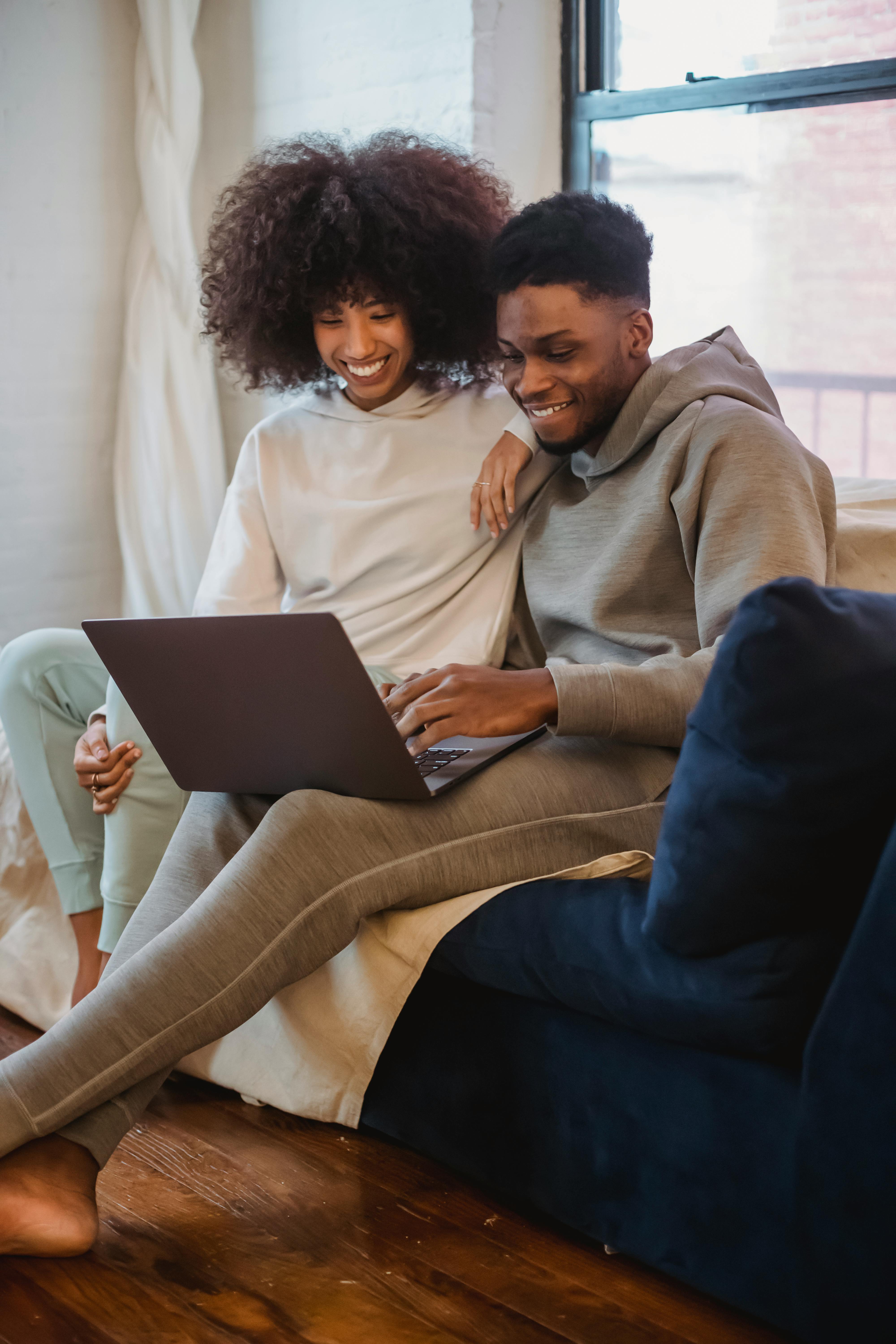 A happy couple on a video call on a laptop | Source: Pexels