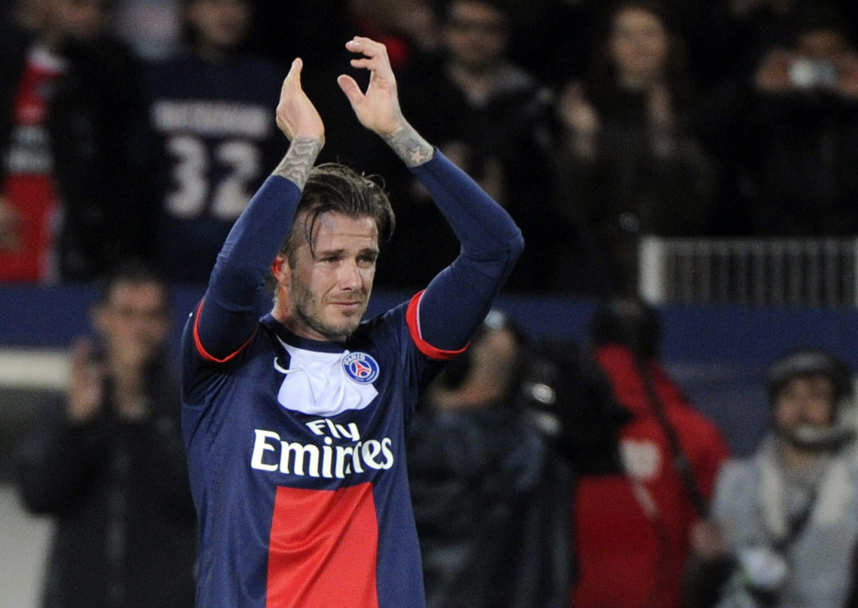 David Beckham cries after being substituted during a French L1 football match between Paris St Germain and Brest at Parc des Princes stadium in Paris on May 18, 2013. | Source: Getty Images