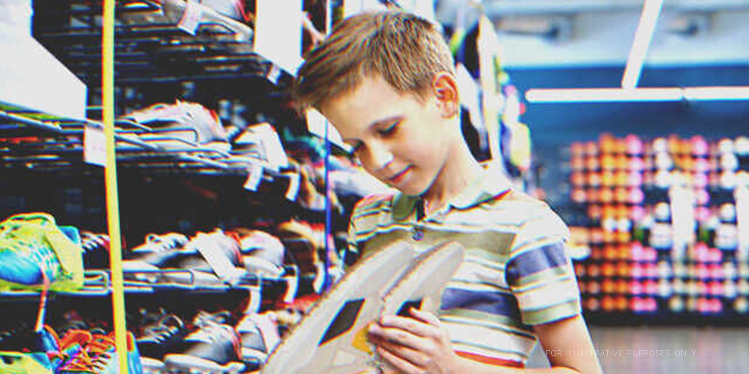 A boy looking at a pair of shoes | Source: Shutterstock