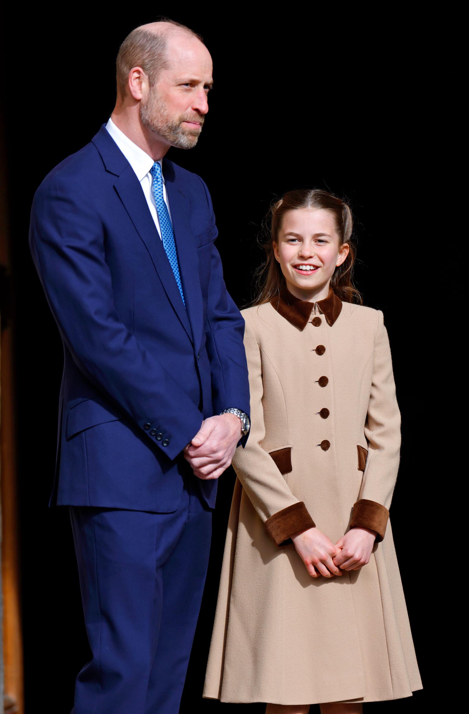 Side by side at the Easter Sunday service at Windsor Castle in April 2026, William in a navy suit and Charlotte in a camel coat with velvet brown trim — the family resemblance unmistakable.