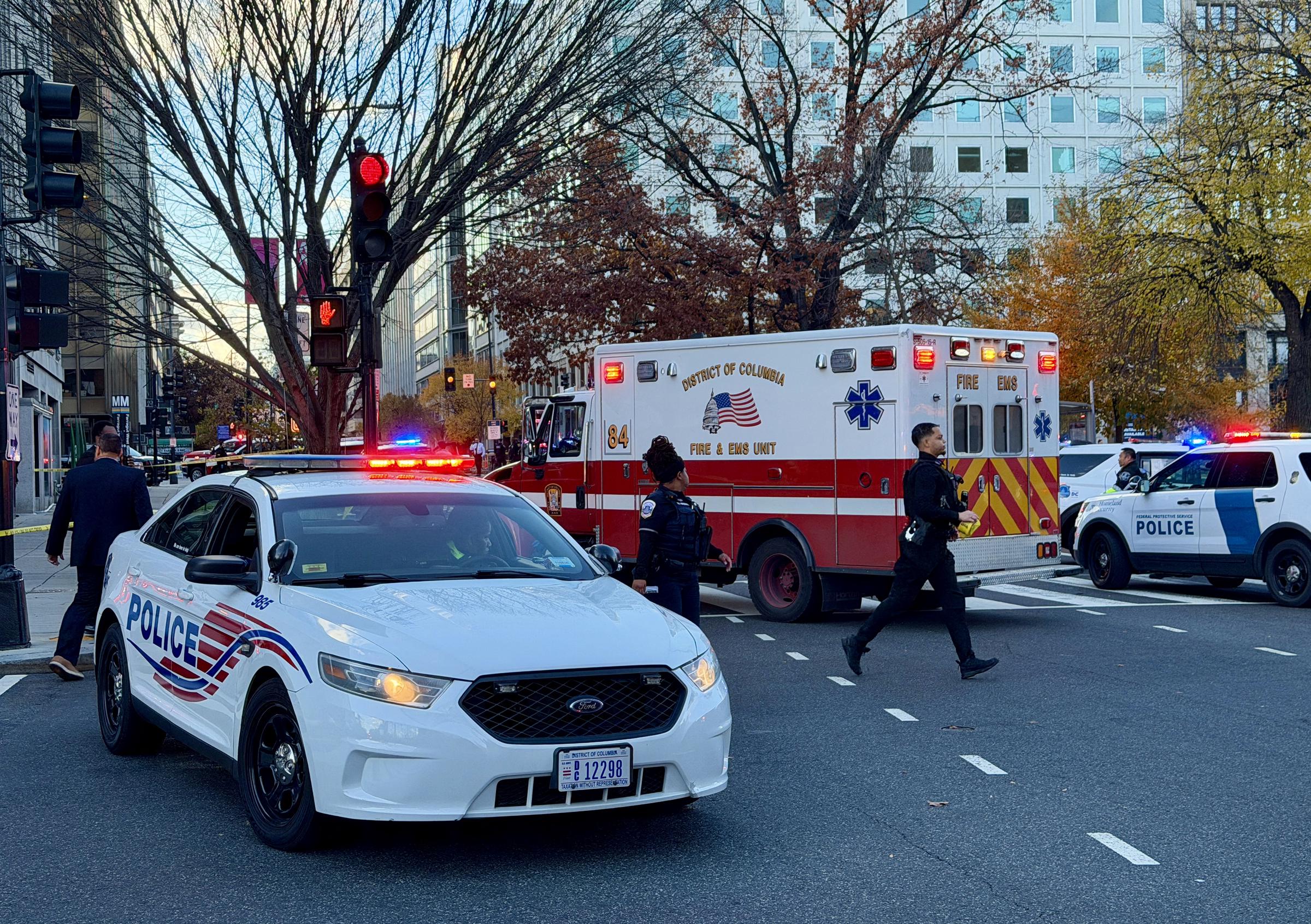 Police and first responders gather near a crime scene after a shooting in downtown Washington, DC, on November 26, 2025 | Source: Getty Images